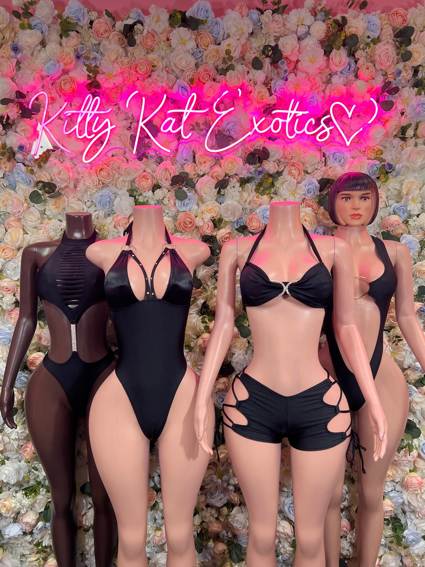 Black one-piece bodysuit with halter neckline and front cutout detail