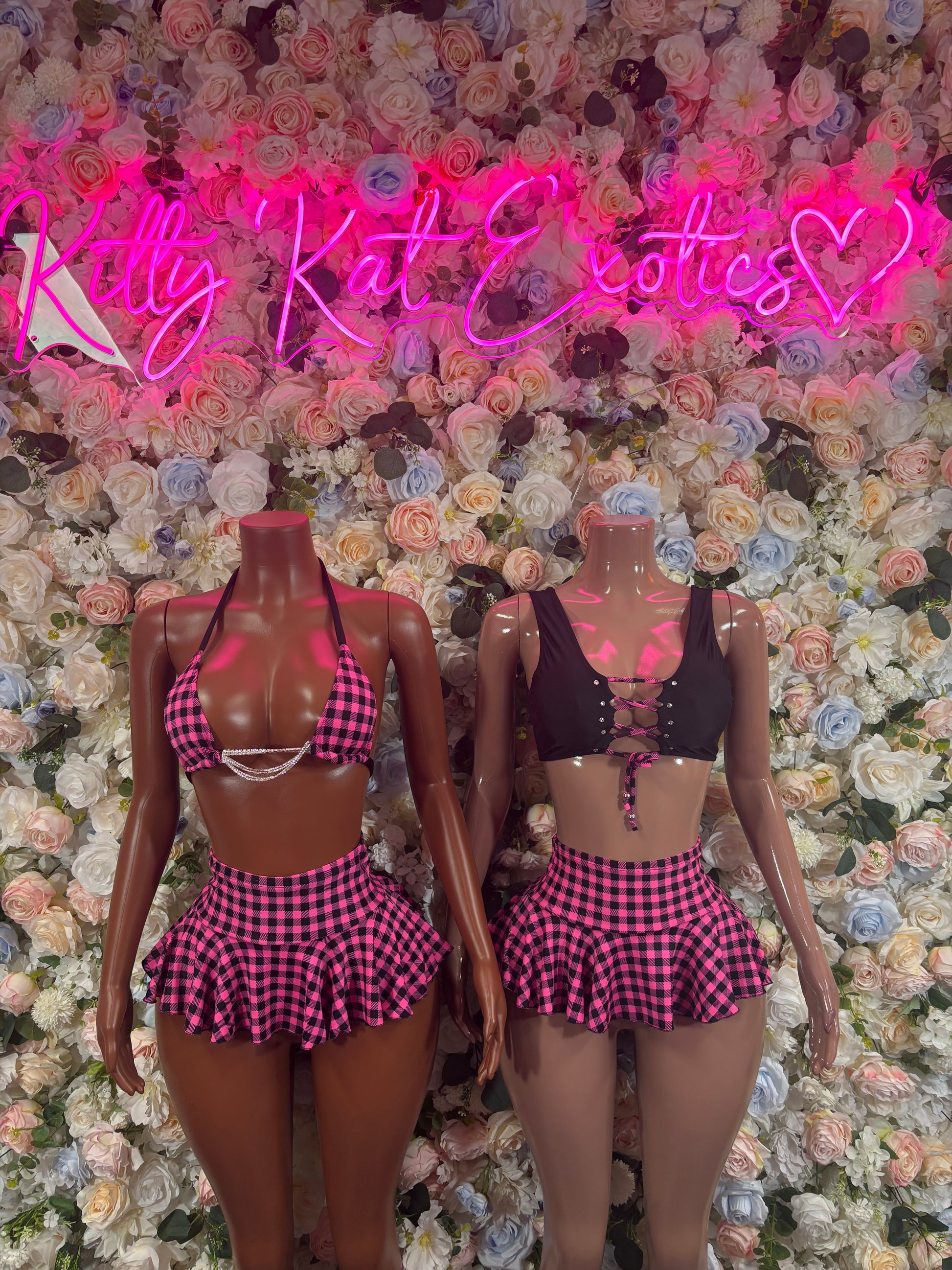 Two purple plaid two-piece skirt sets, halter tops and flared mini skirts