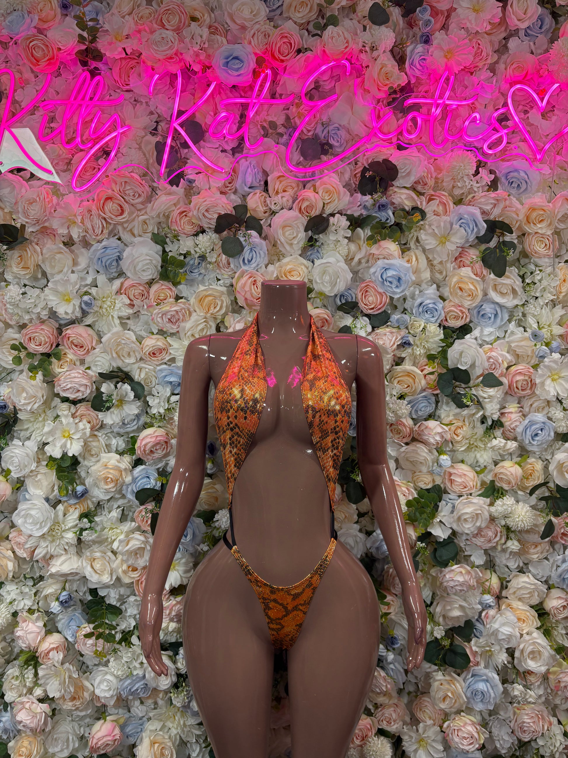 Orange snake-print one-piece bodysuit with front cutouts and strappy back