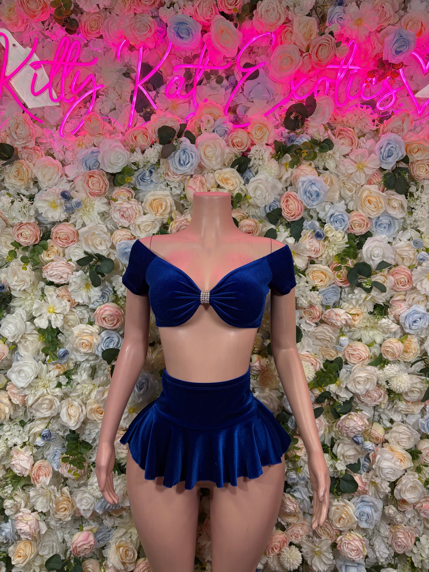 Blue velvet off-shoulder skirt set with bow detail and flared mini skirt