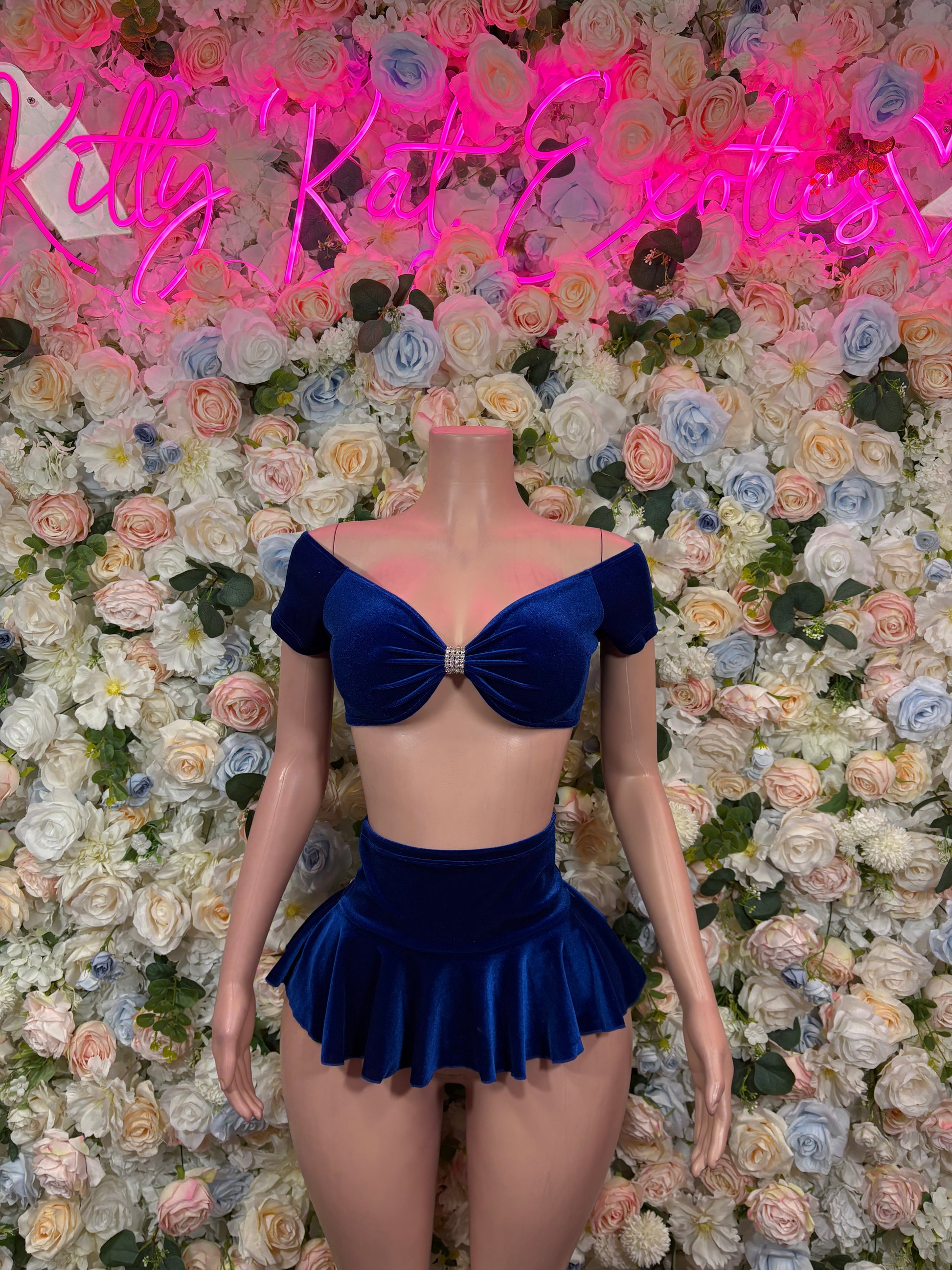 Blue velvet off-shoulder skirt set with bow detail and flared mini skirt