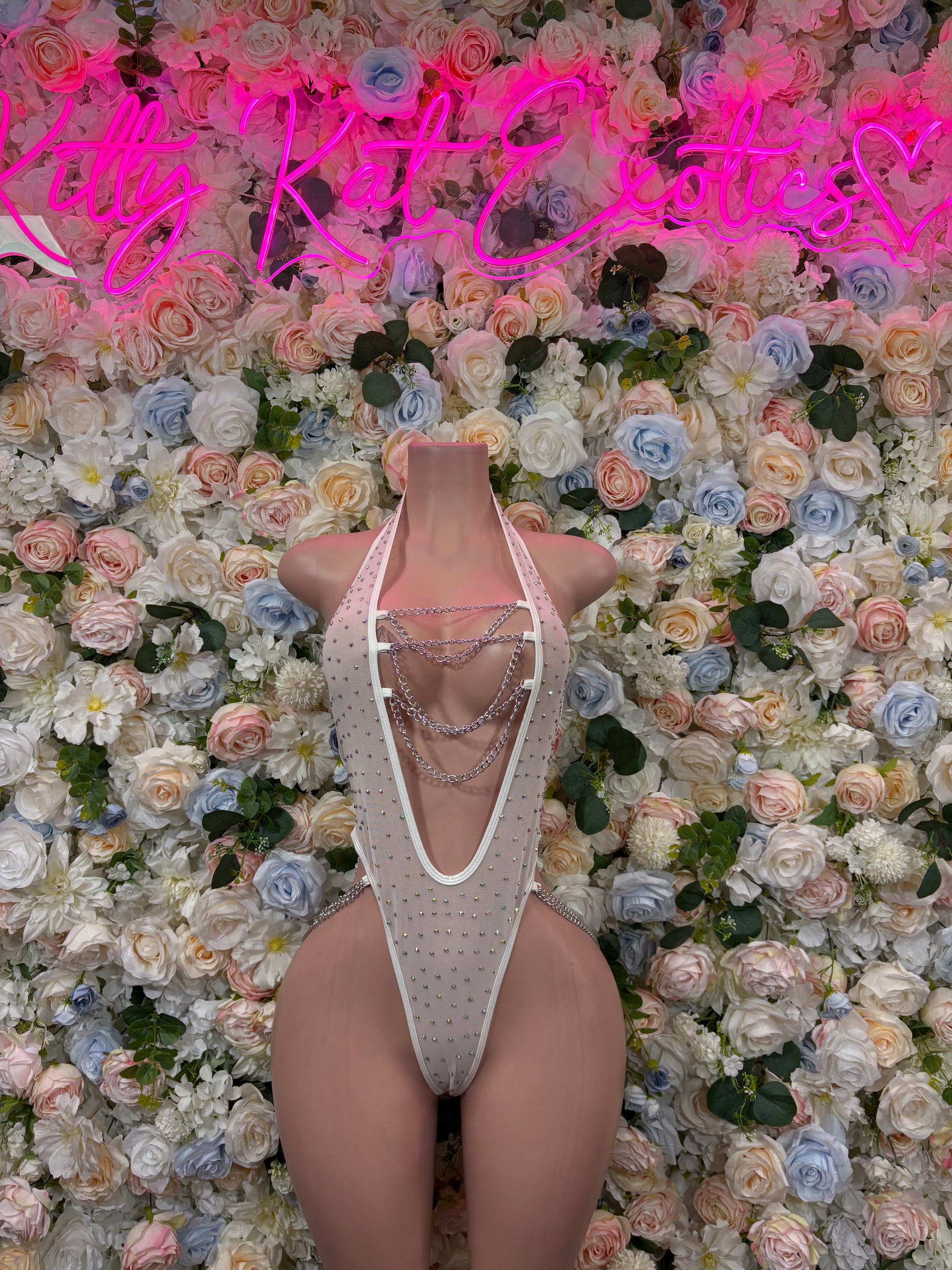 White rhinestone fishnet bodysuit with chainlink straps, front view