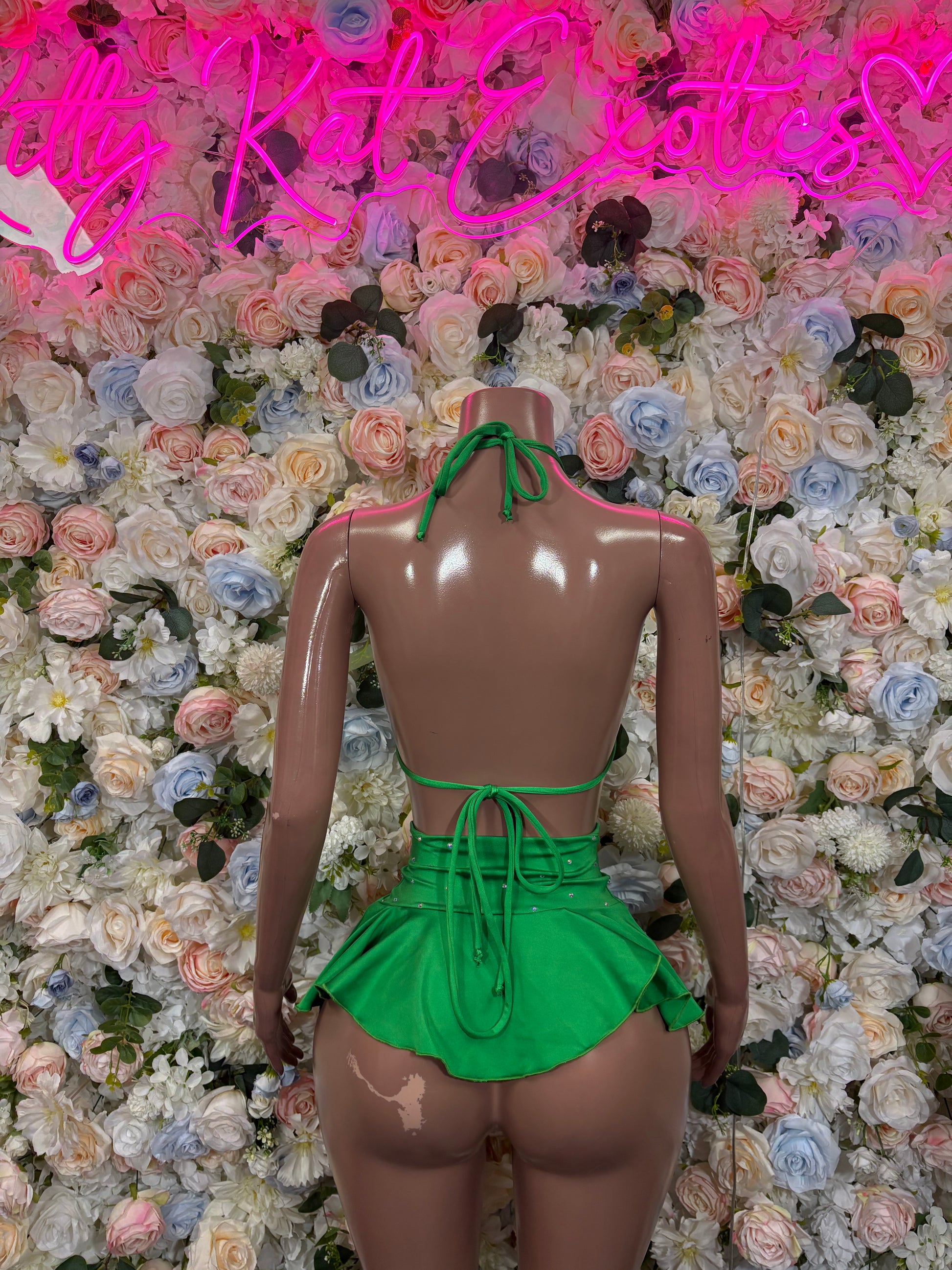 Green two-piece skirt set, strappy crisscross back top with tied mini skirt