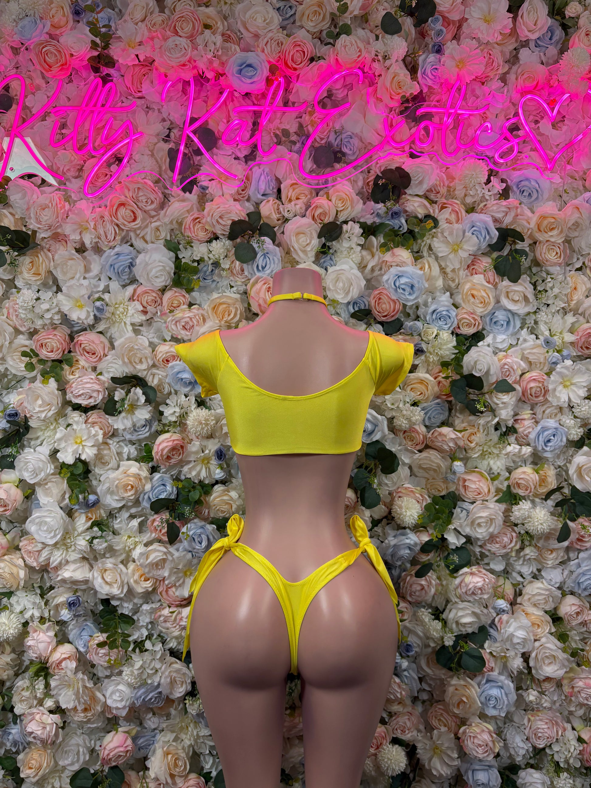 Yellow strappy bra and high-cut thong bottoms set, back view on mannequin