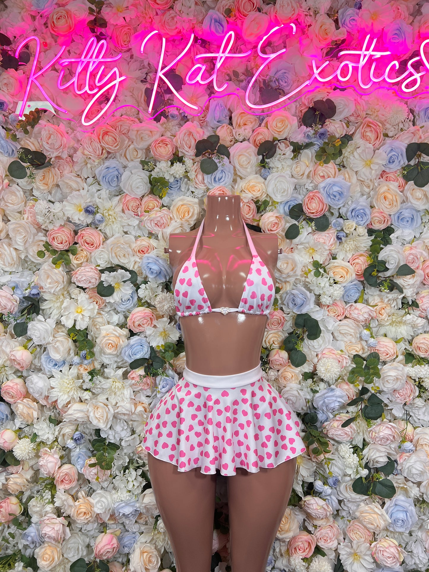 Pink heart print two-piece skirt set with tie halter top and ruffled mini skirt