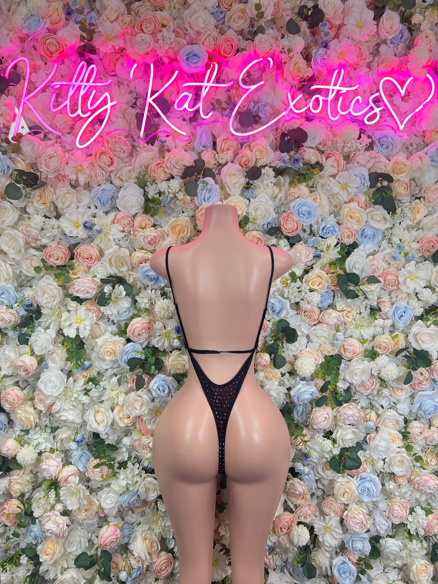 Black rhinestone mesh bodysuit with open back and crisscross strap