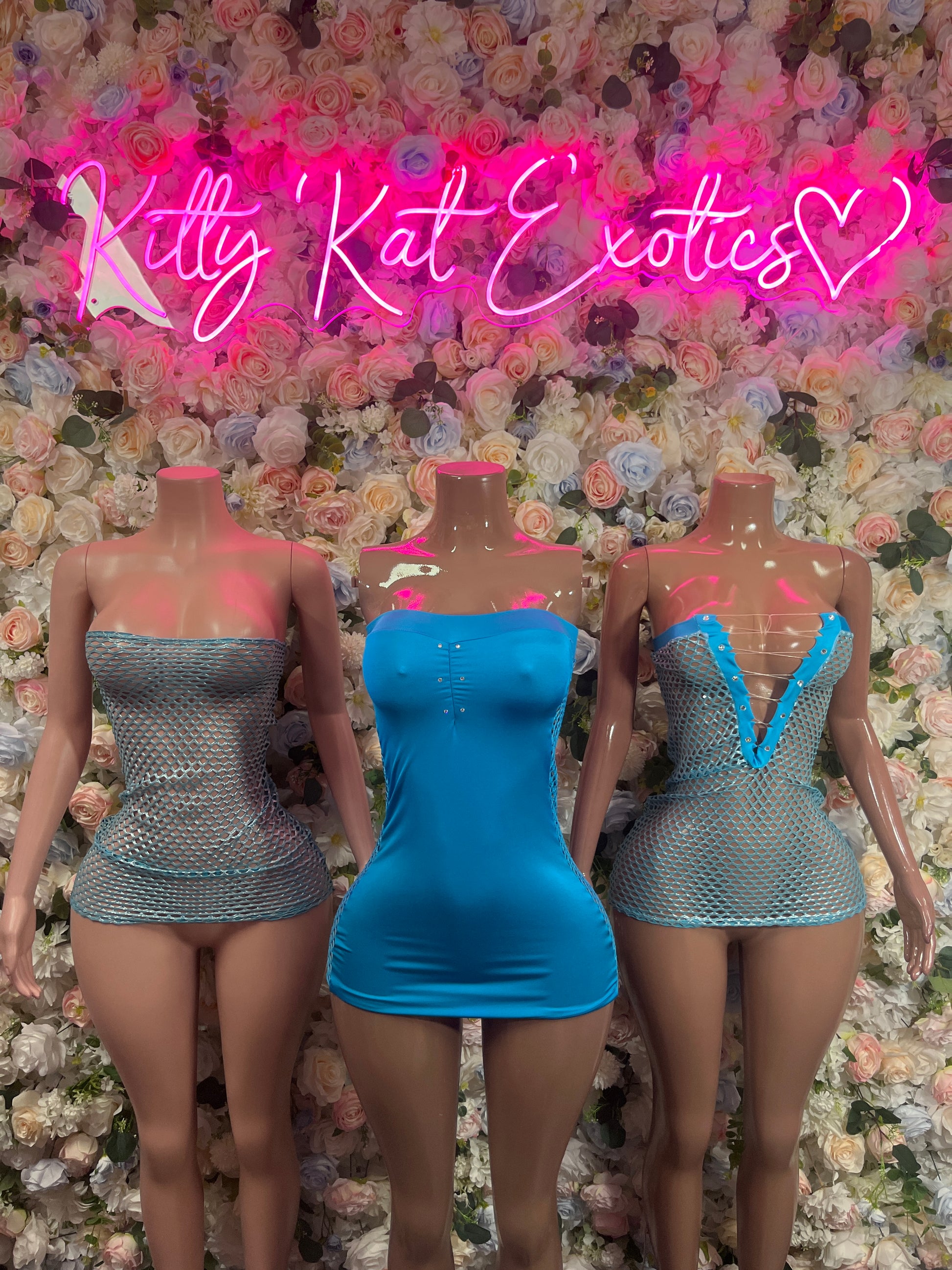 Blue one-piece dress on mannequin, strapless fitted mini, open back view