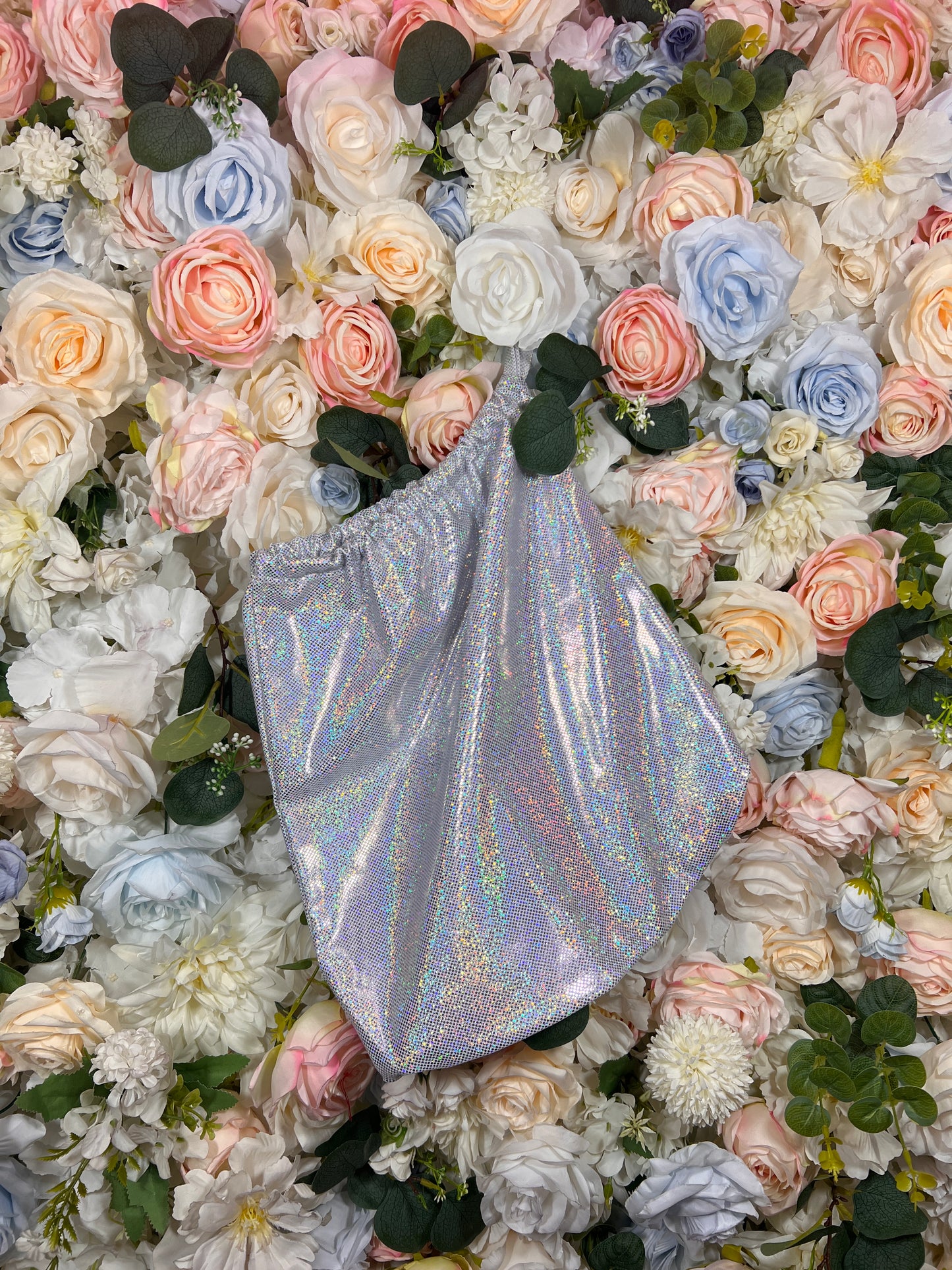 Silver metallic pouch money bag with rounded top and iridescent shimmer