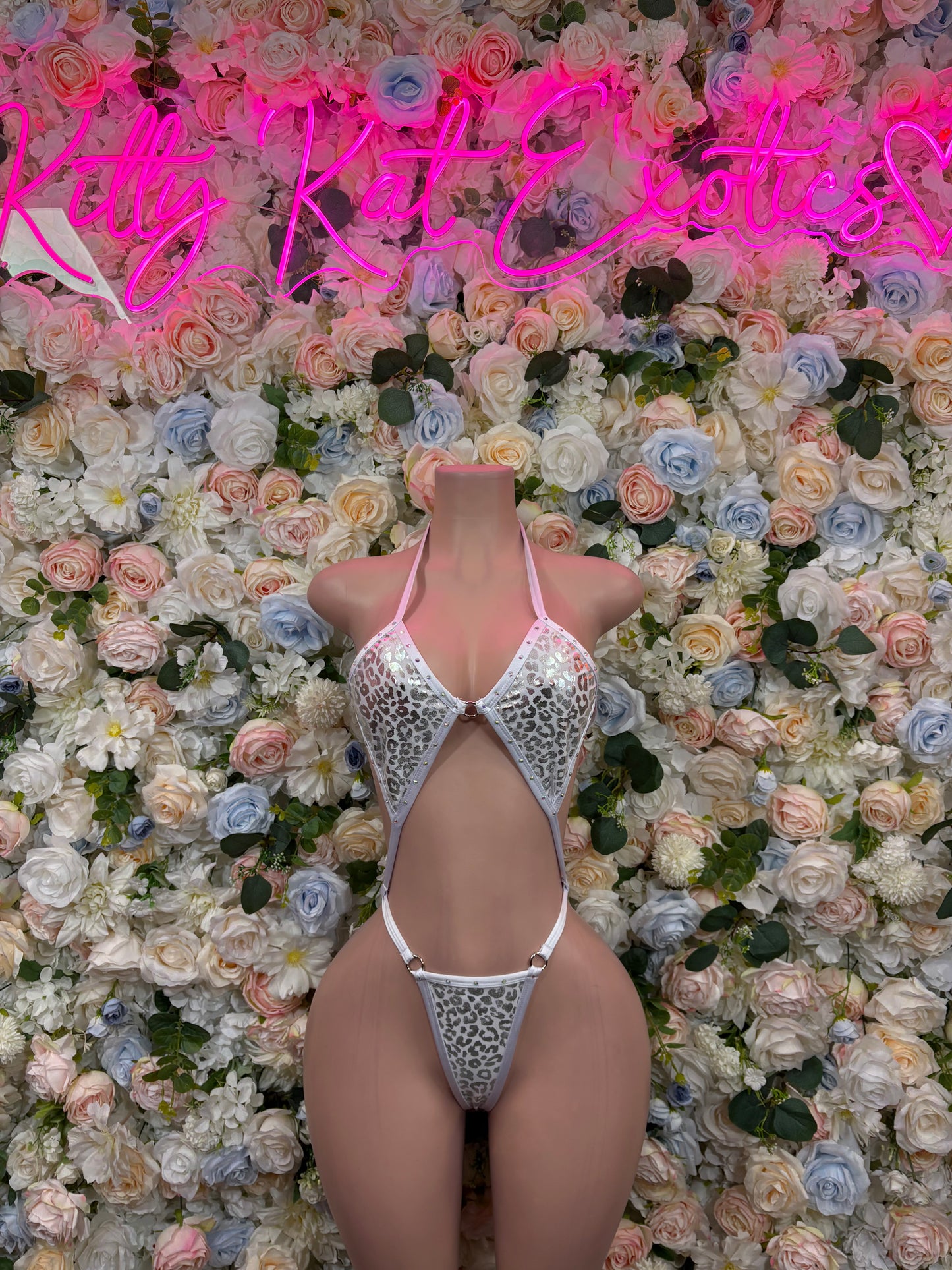 Silver hologram cheetah-print halter bodysuit with V neckline and cheeky cut