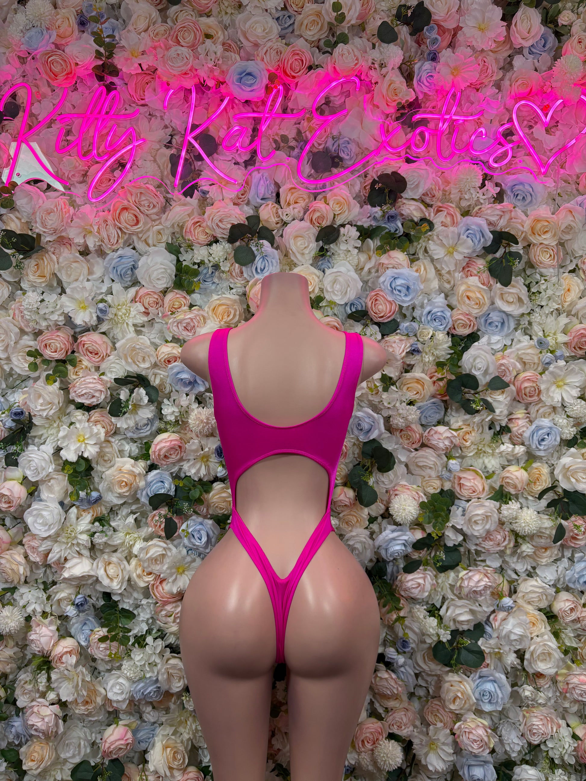 Pink open-back bodysuit with V-back cutout