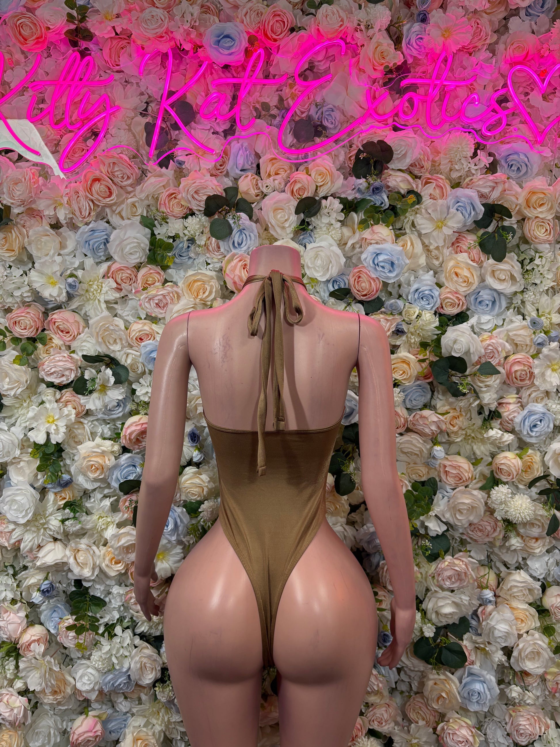 Tan halter bodysuit with strappy back and long tie detail