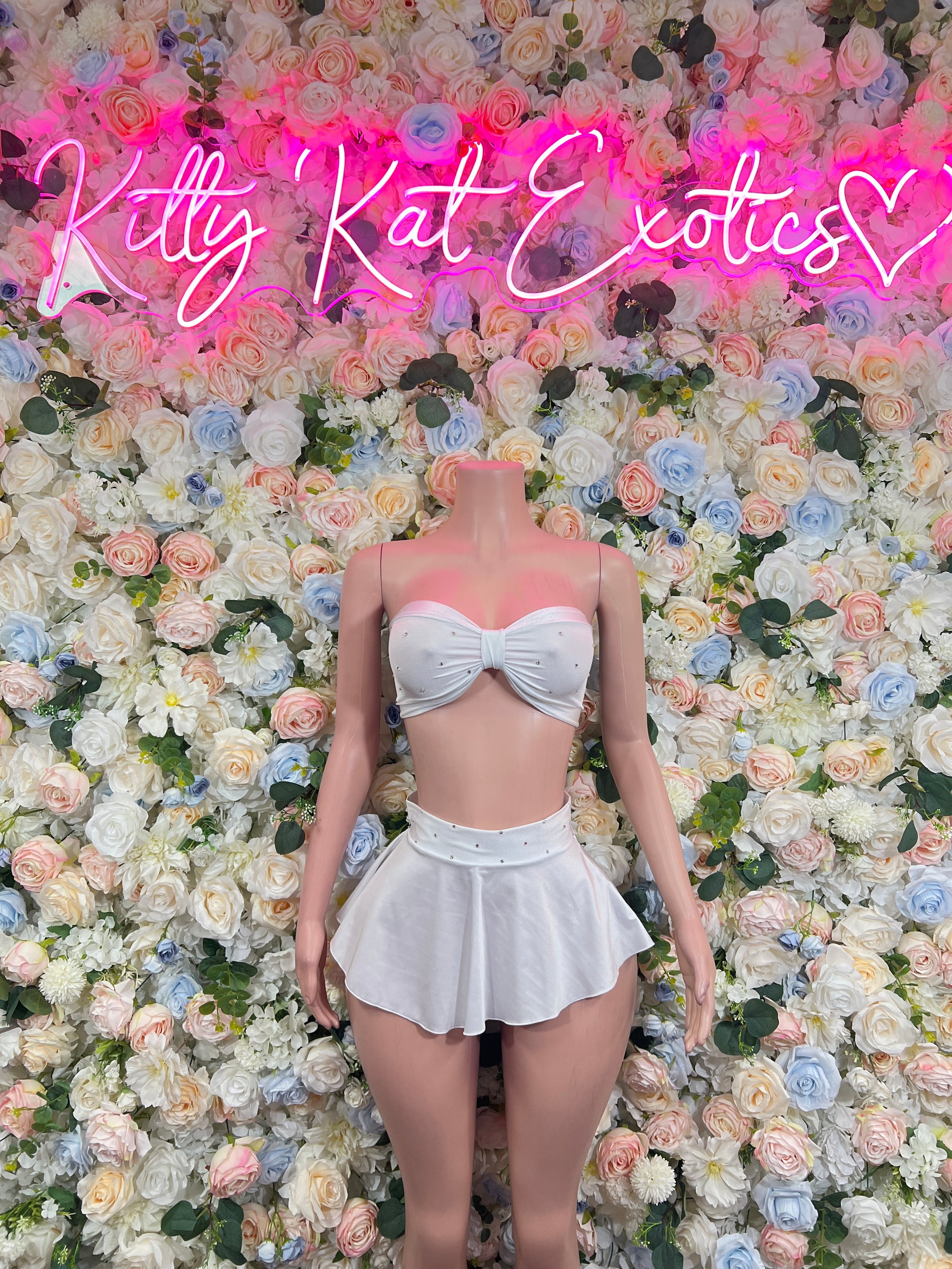 White two-piece rave outfit: strapless bandeau top with ruffled mini skirt set