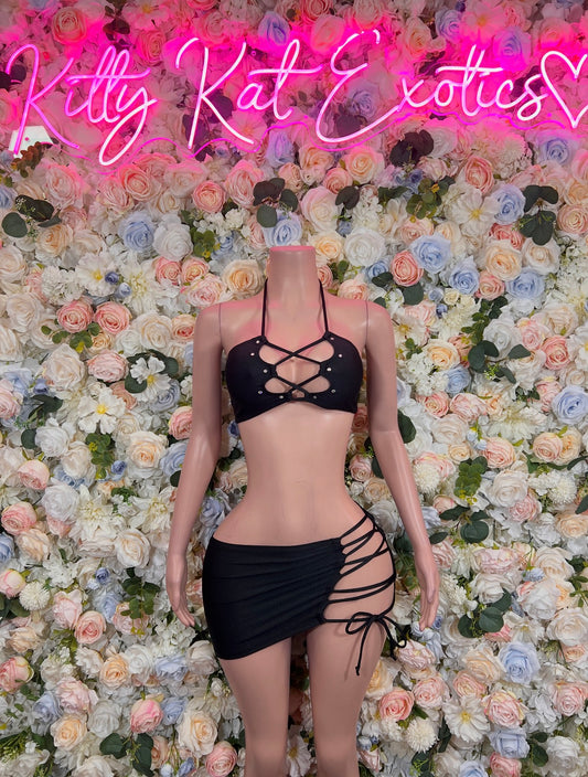 Black strappy lace-up halter crop top and mini skirt set with rhinestone accents