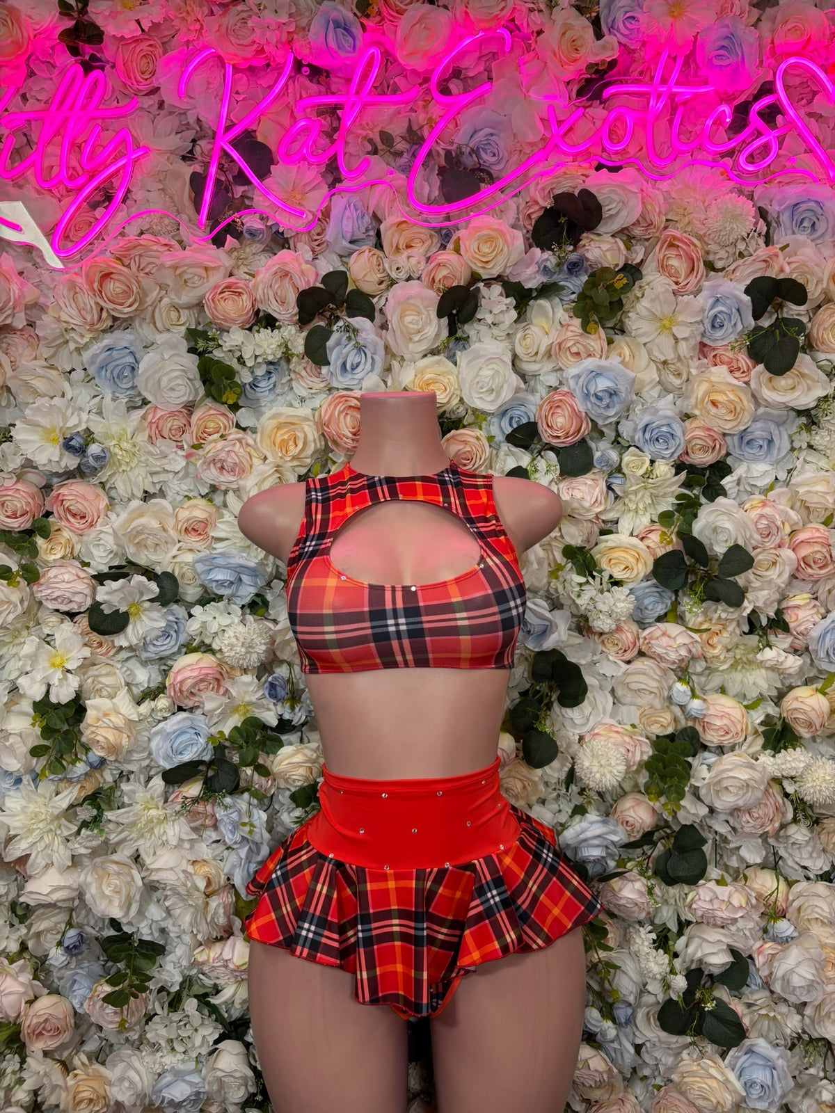 Red plaid halter crop top with open back and ruffled mini skirt