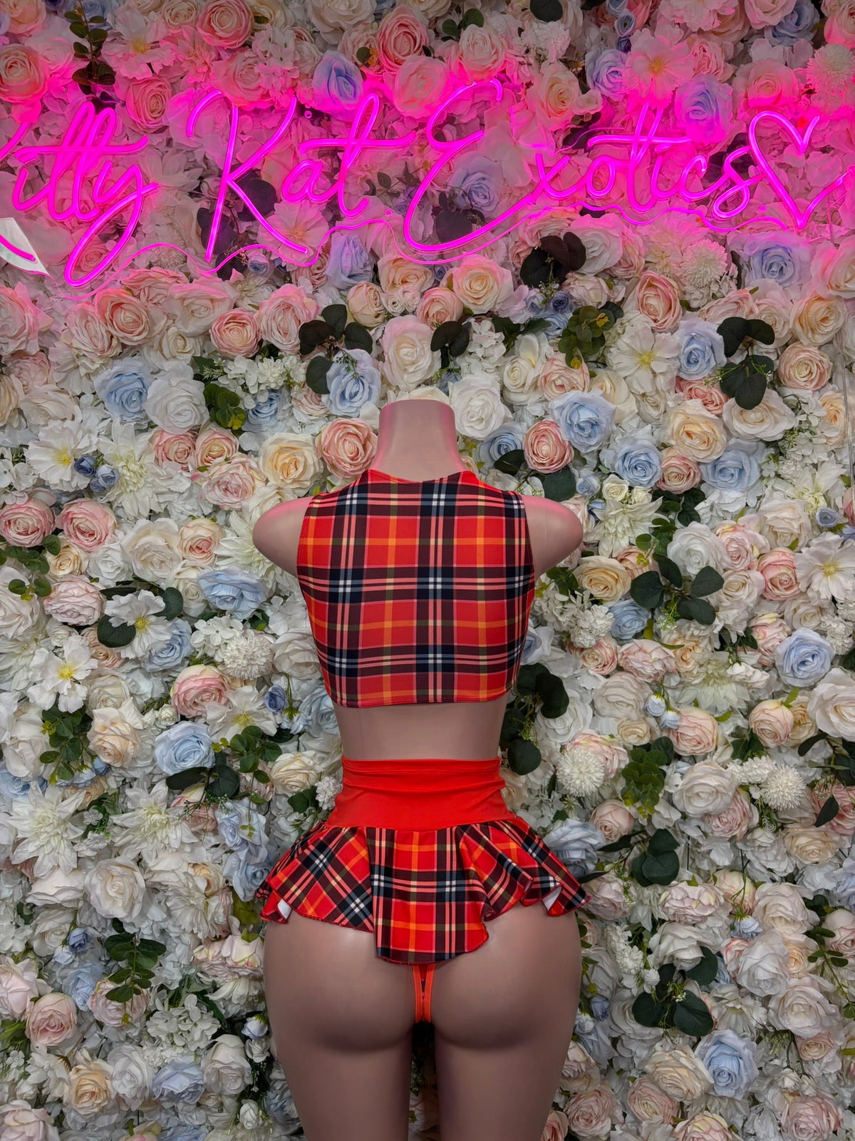 Red plaid halter backless crop top and matching ruffled mini skirt, rear view