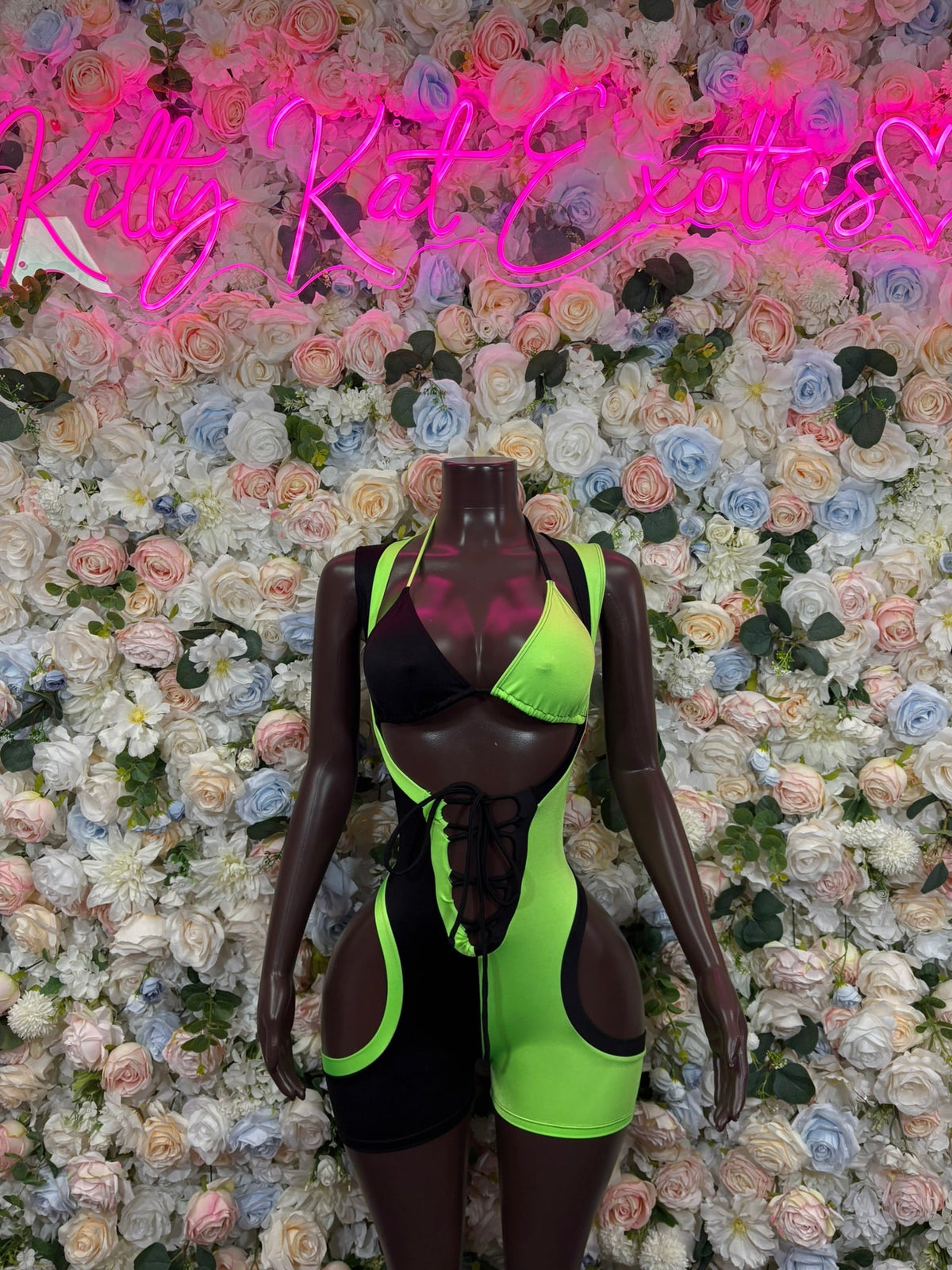 Black & neon green cutout lace-up romper with halter neckline