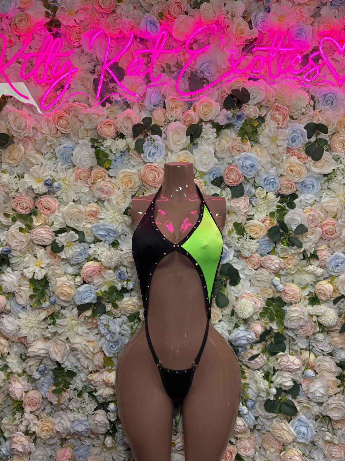 Black and lime contrast slingshot bodysuit with high-cut thong and V neckline