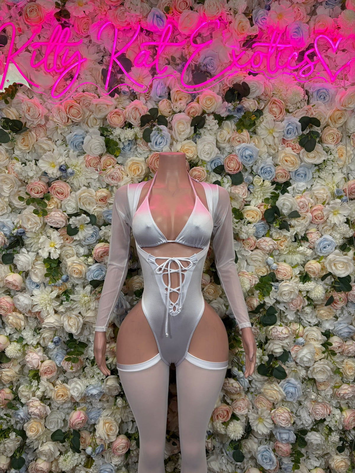 White lace-up cutout bodysuit with long sleeves, underbust straps and open back