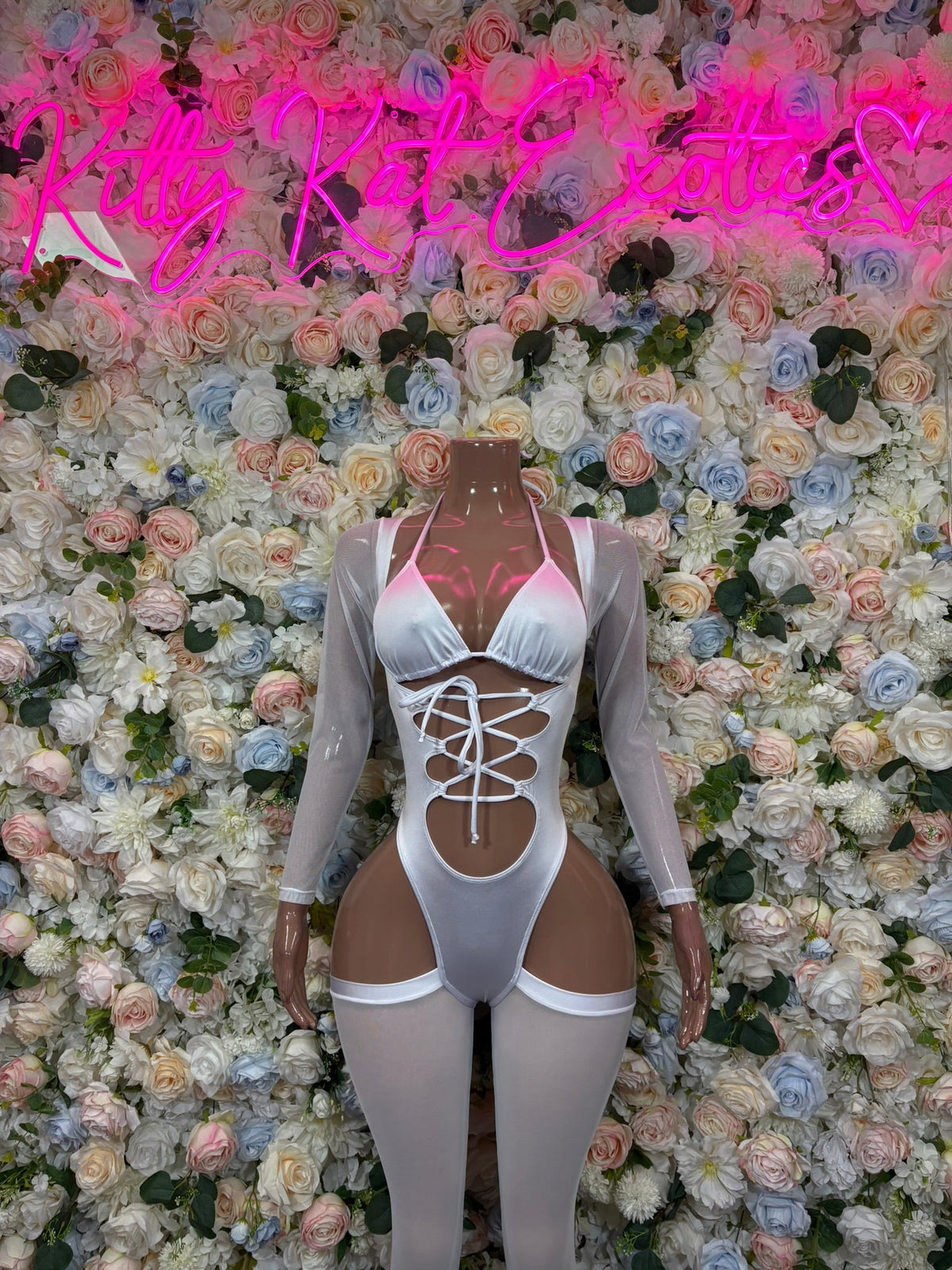White long-sleeve high-cut bodysuit with lace-up corset front and high leg openings