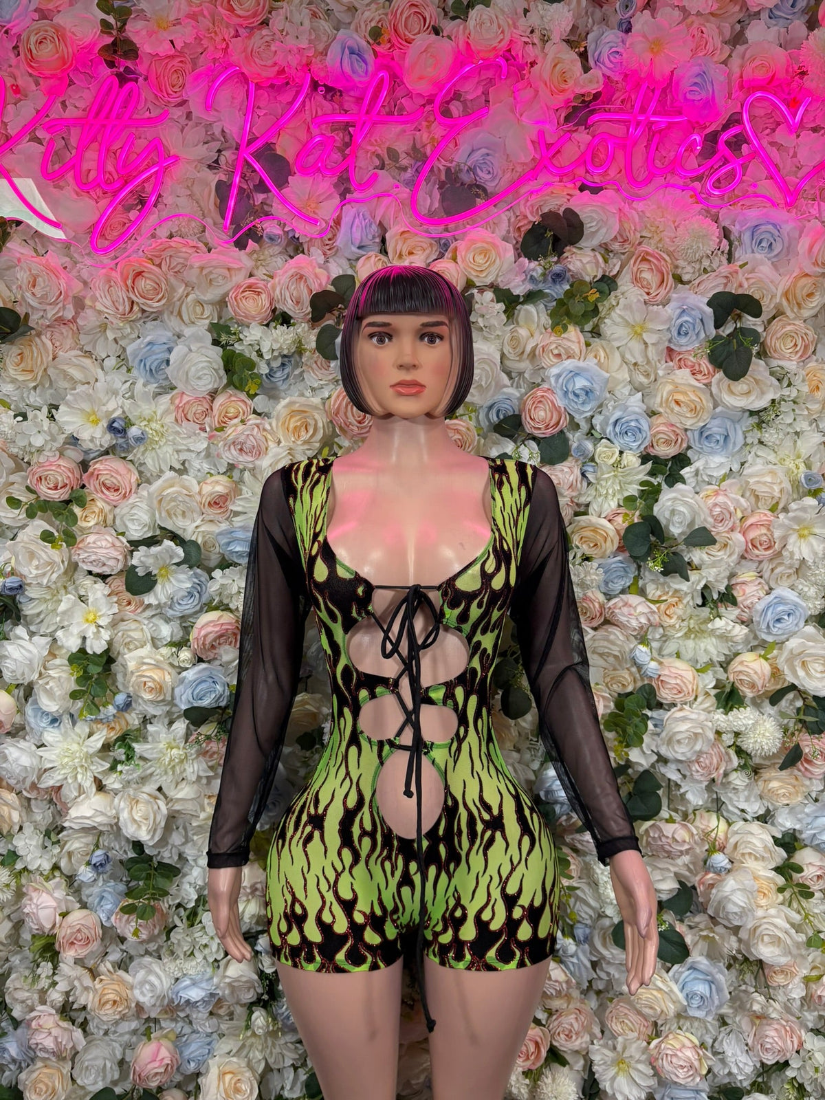 Green flame mesh long-sleeve bodysuit with black lace-up front and sheer sleeves