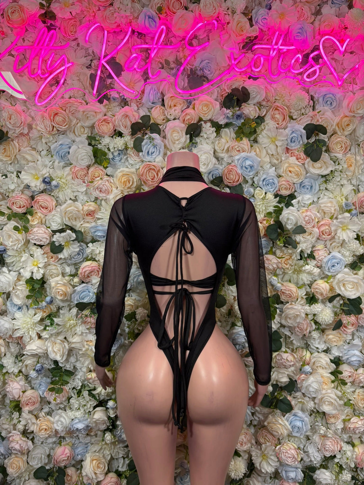 Black sheer long-sleeve bodysuit with neon green flame front and open back tie