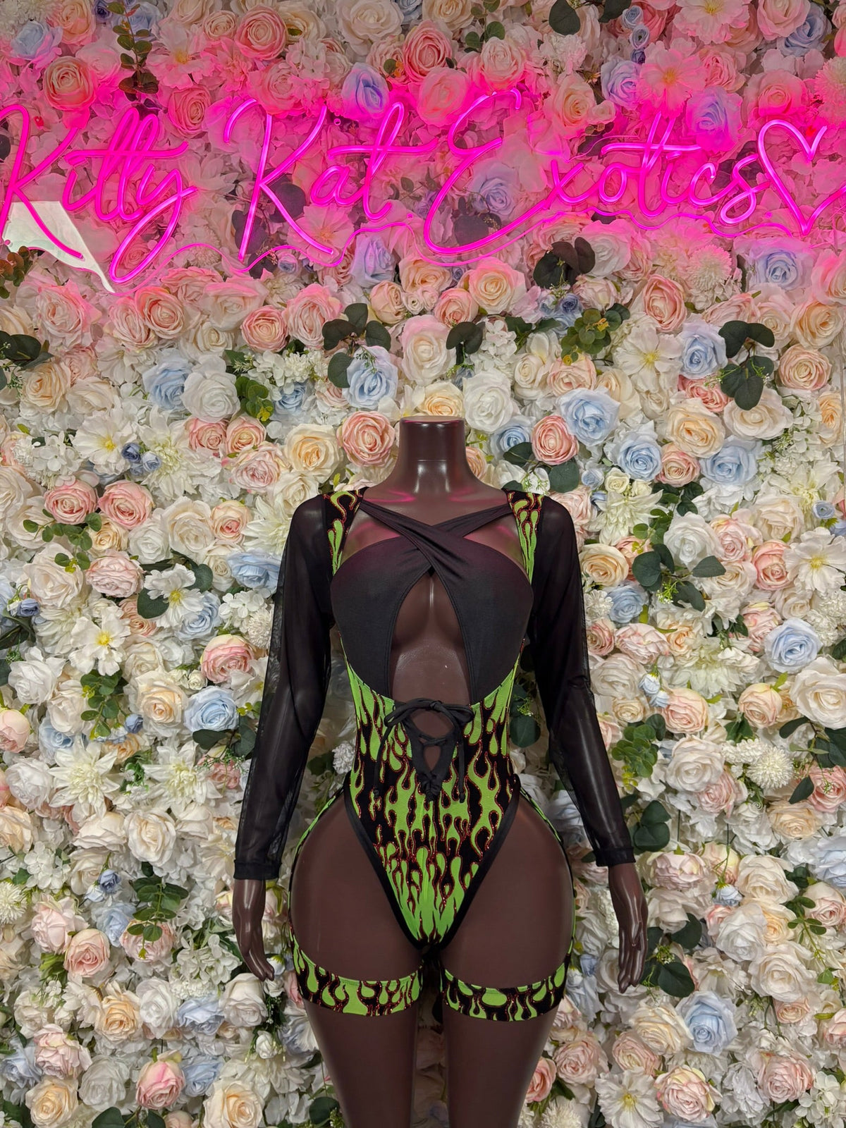 Black sheer bodysuit with neon green flame print, high-cut legs, front cutouts