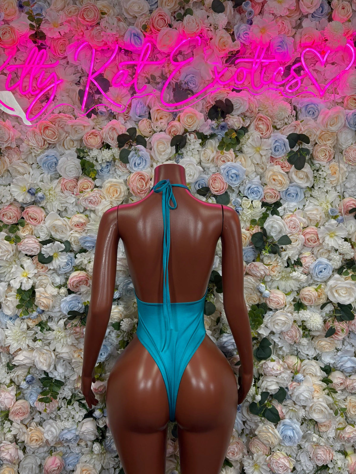 Teal halter cutout bodysuit back view with tie straps and open neckline