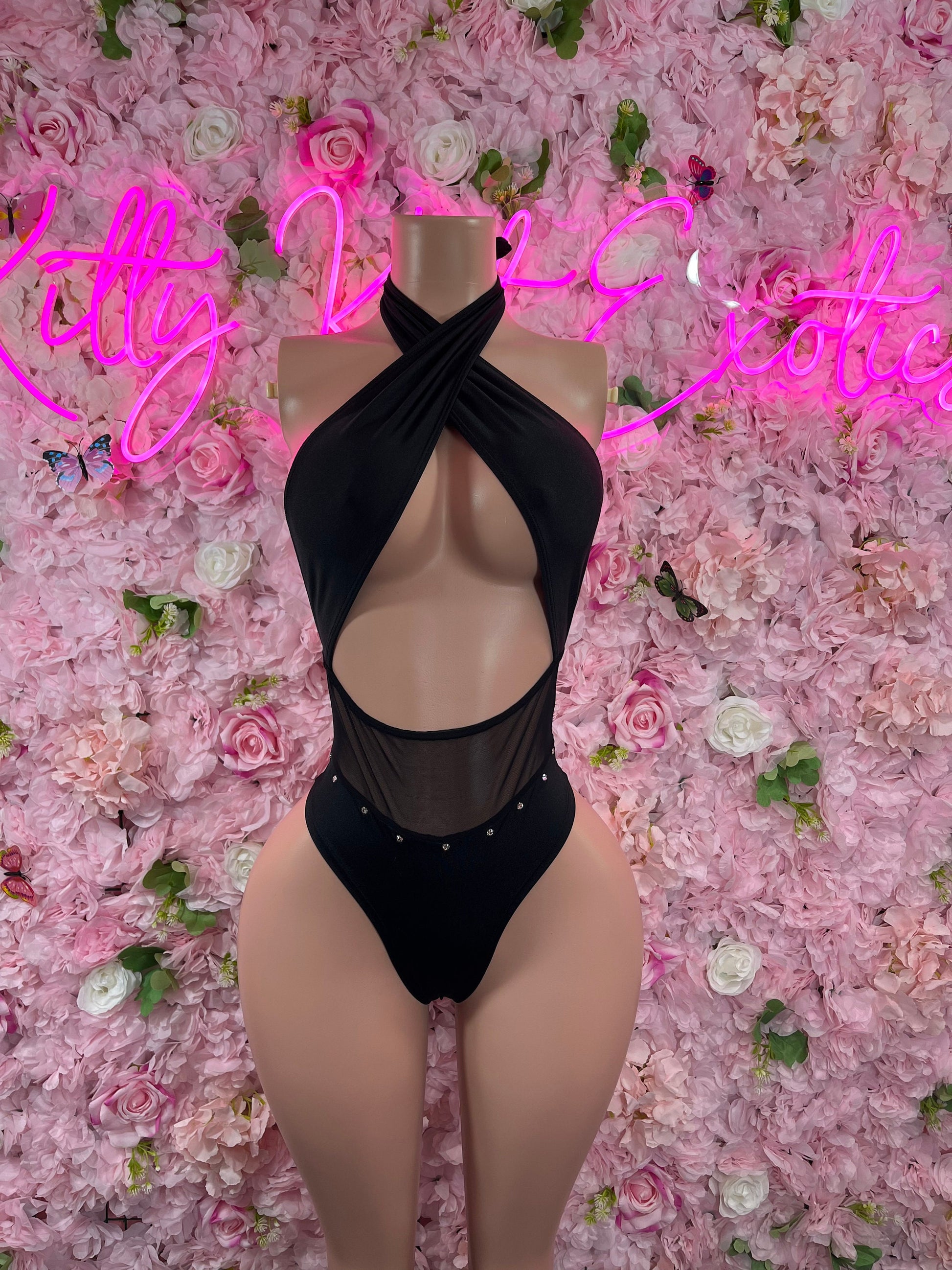 Black halter one-piece bodysuit with cross-front straps and oval chest cutout