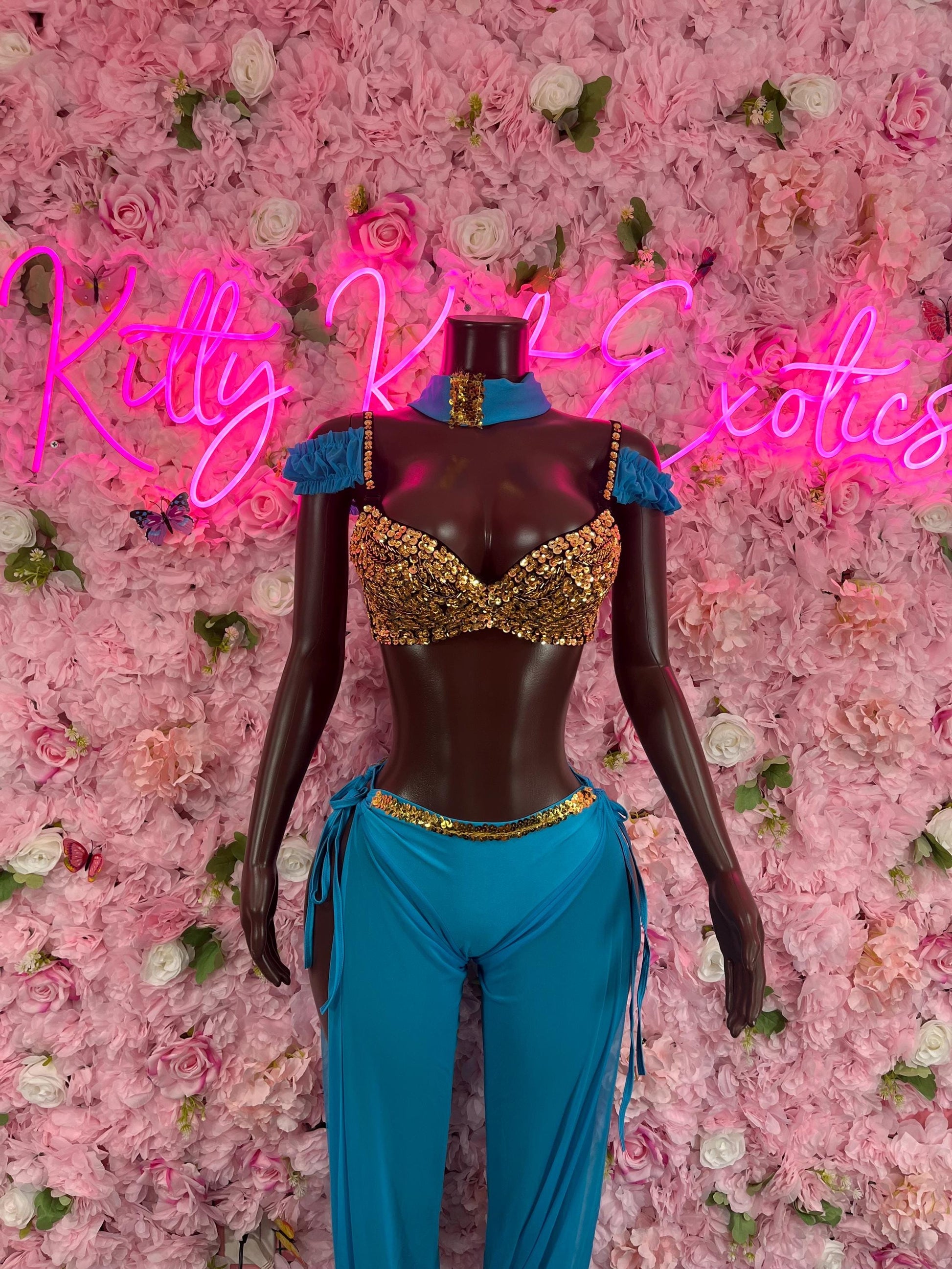 Princess costume set with gold bra-style bodice, teal pants, and brown puff sleeves