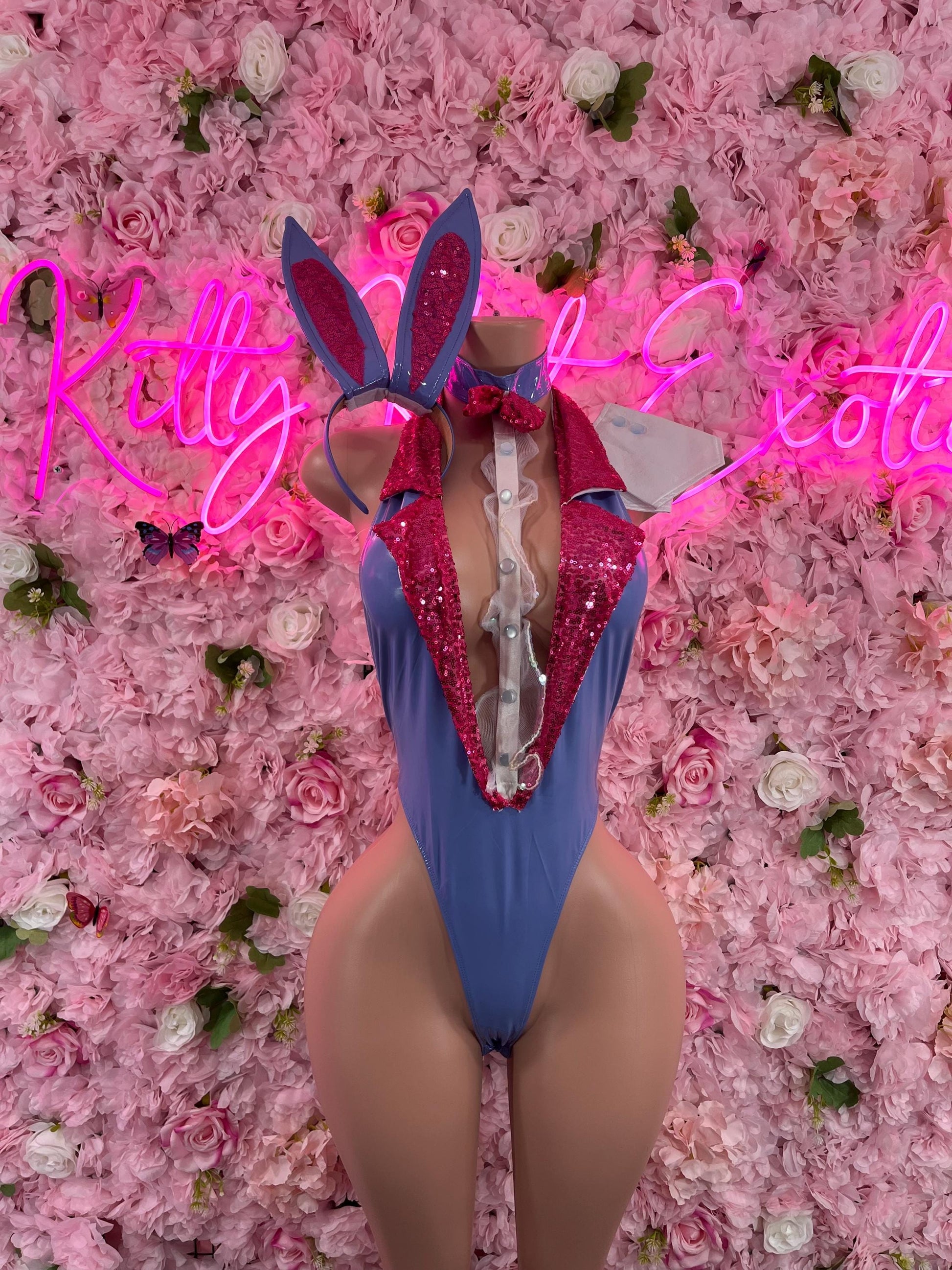 Blue sequin bunny bodysuit with tall ears, pink bow, front zipper