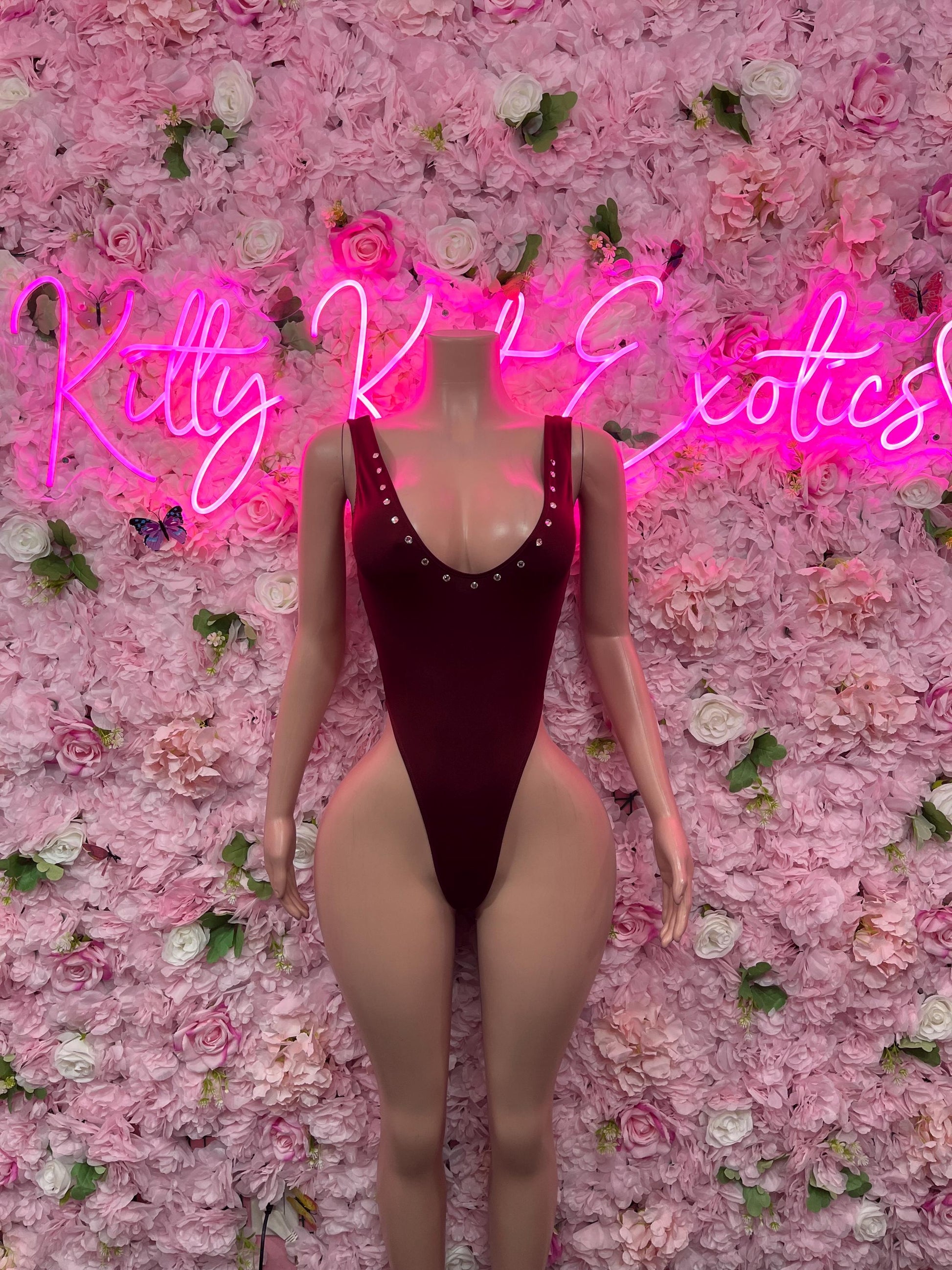 One-piece bodysuit in dark red with V neckline and high-cut leg openings