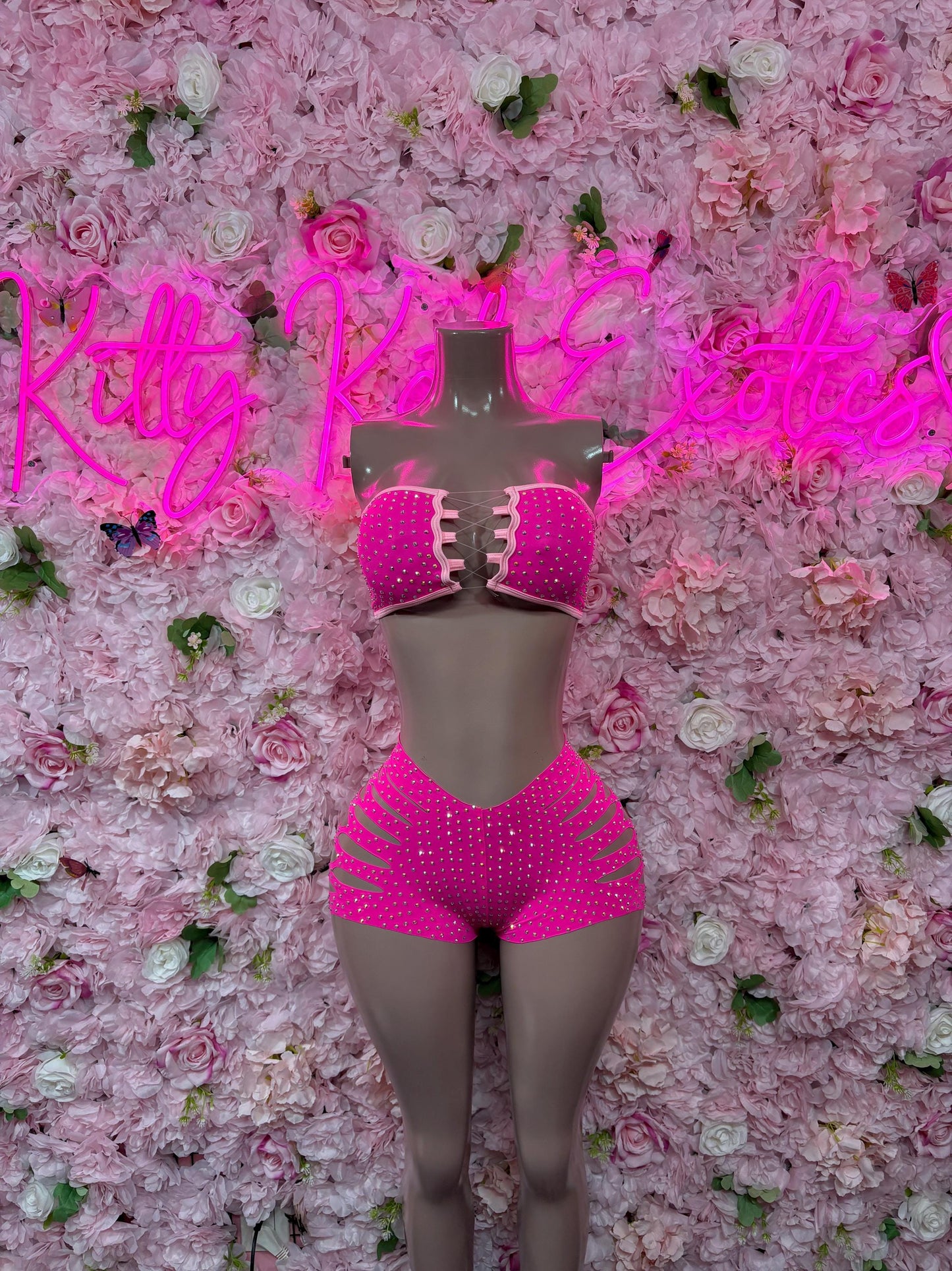 Pink rhinestone bodysuit set with sleeveless top and high-cut shorts, front view
