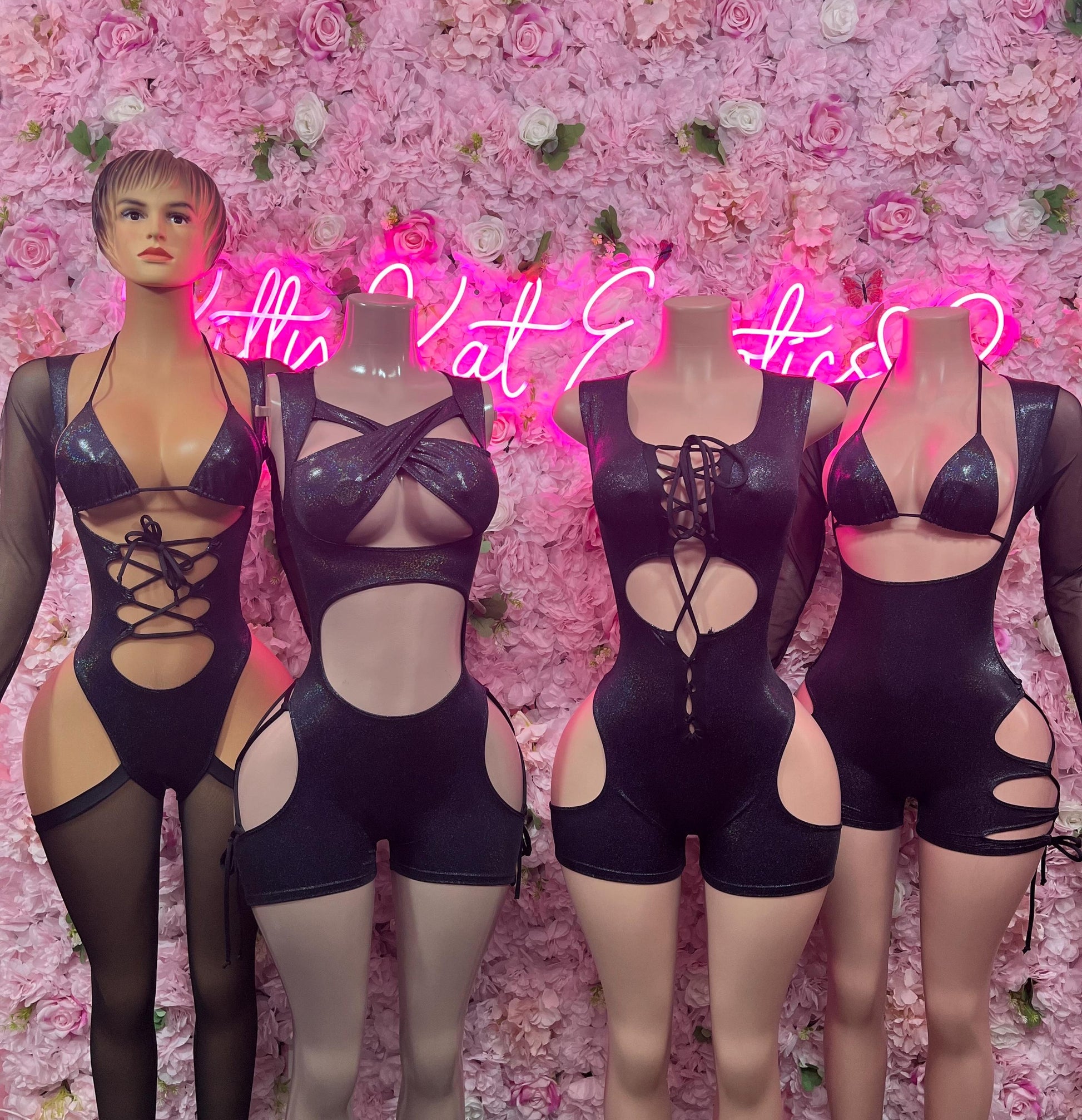 Black metallic cutout one-piece bodysuit with lace-up front, chest cutouts, long sleeves
