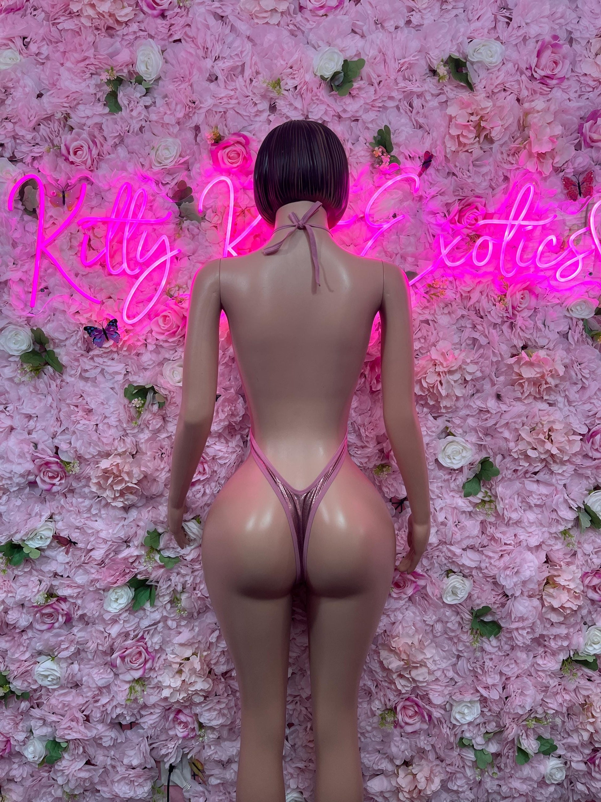 Pink one-piece dance bodysuit, low V back and thin straps, high-cut legs