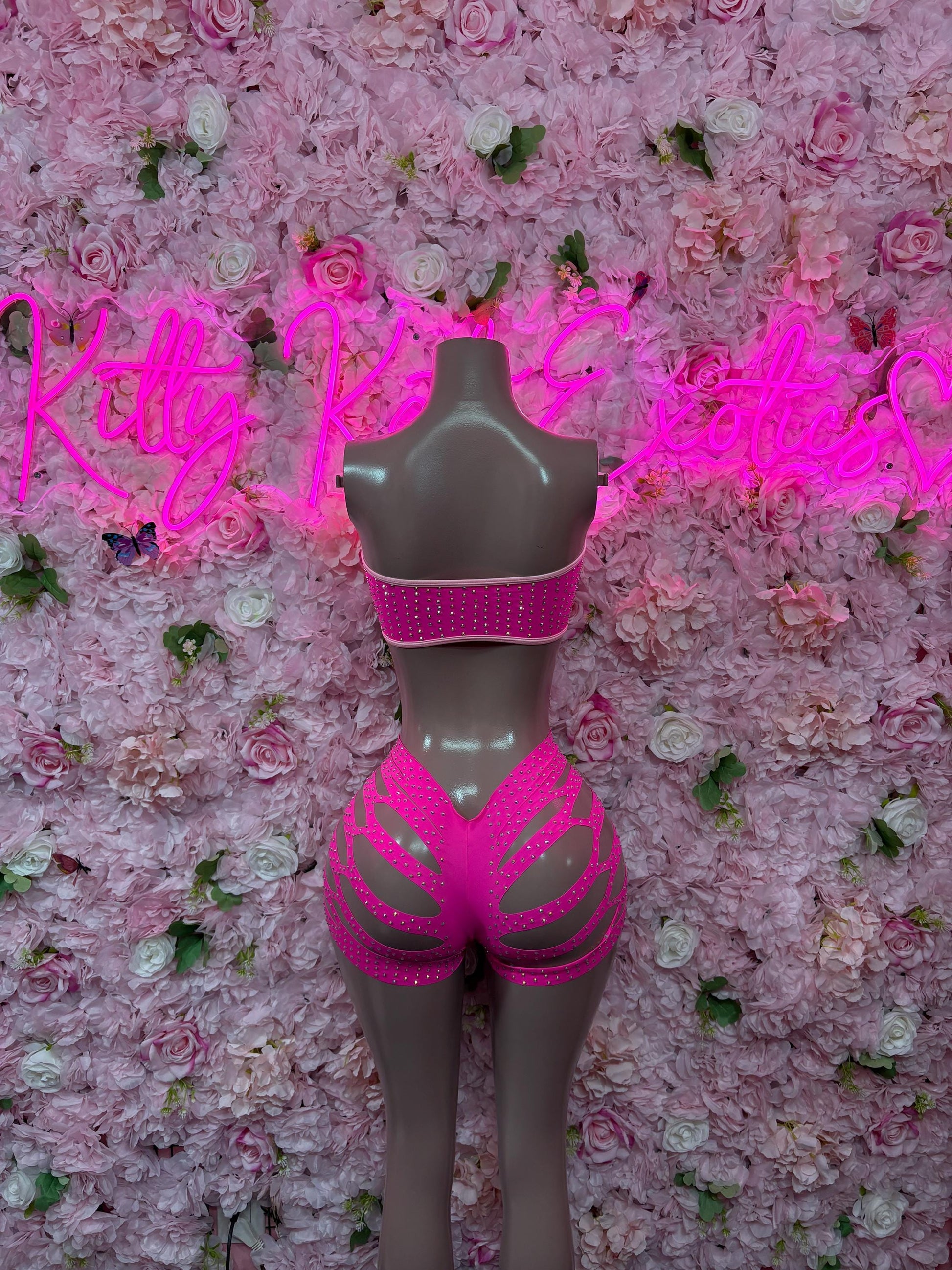 Pink rhinestone bodysuit set with backless top and cutout high-cut shorts, back view