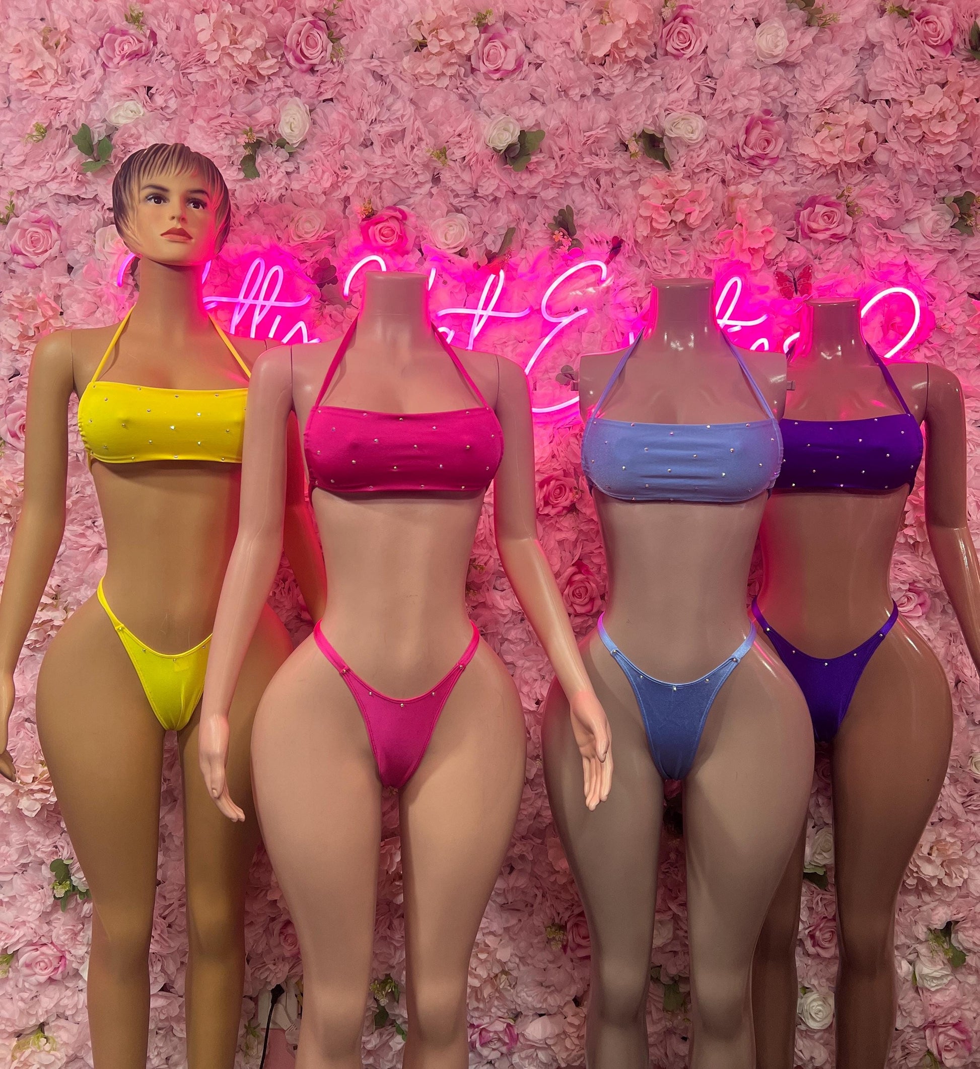 Multiple bikini outfits on models: yellow, pink, blue, and purple two-piece sets