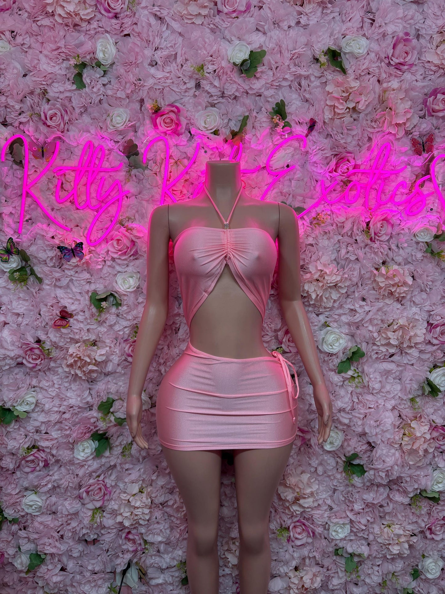 Pink mini dance dress with cutout waist and front bow detail