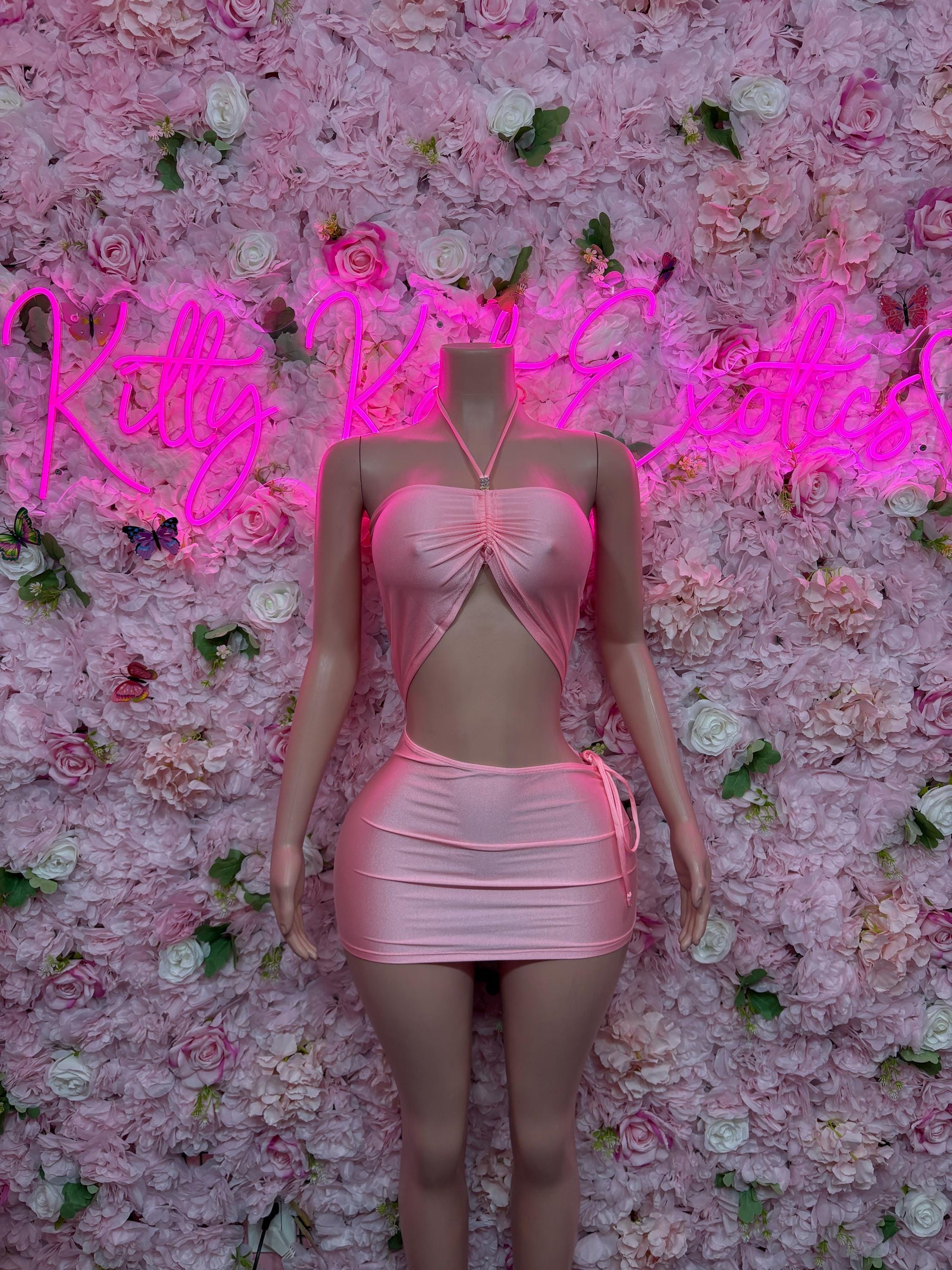 Pink mini dance dress with cutout waist and front bow detail