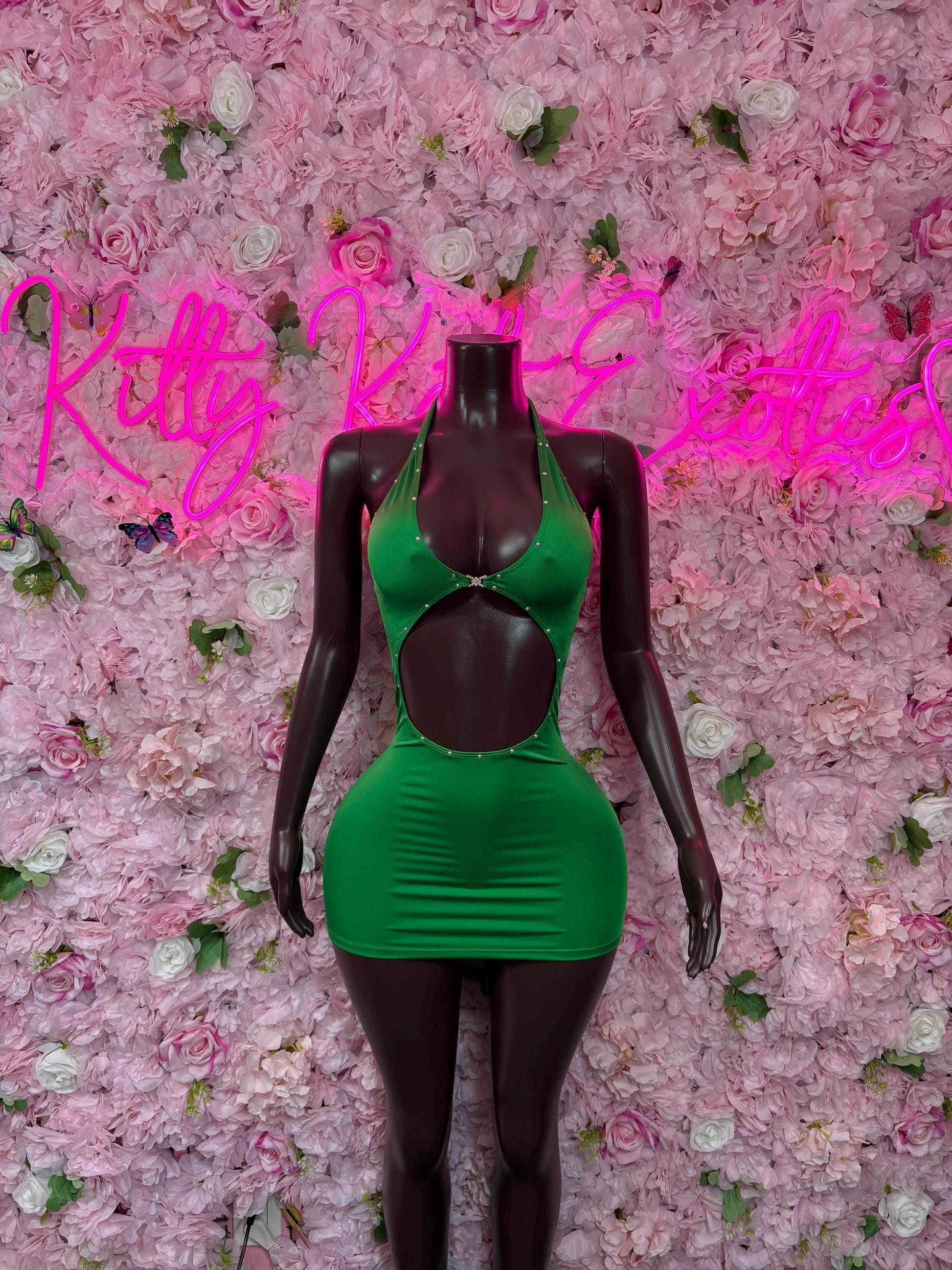 Green cutout one-piece dress with black long sleeves and halter straps