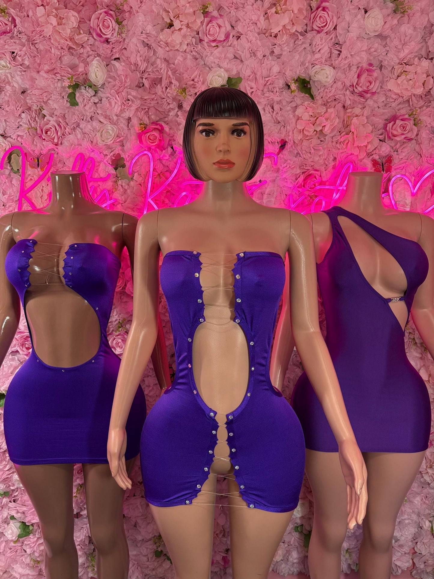 Purple strapless romper dress with open center panel and sweetheart bust