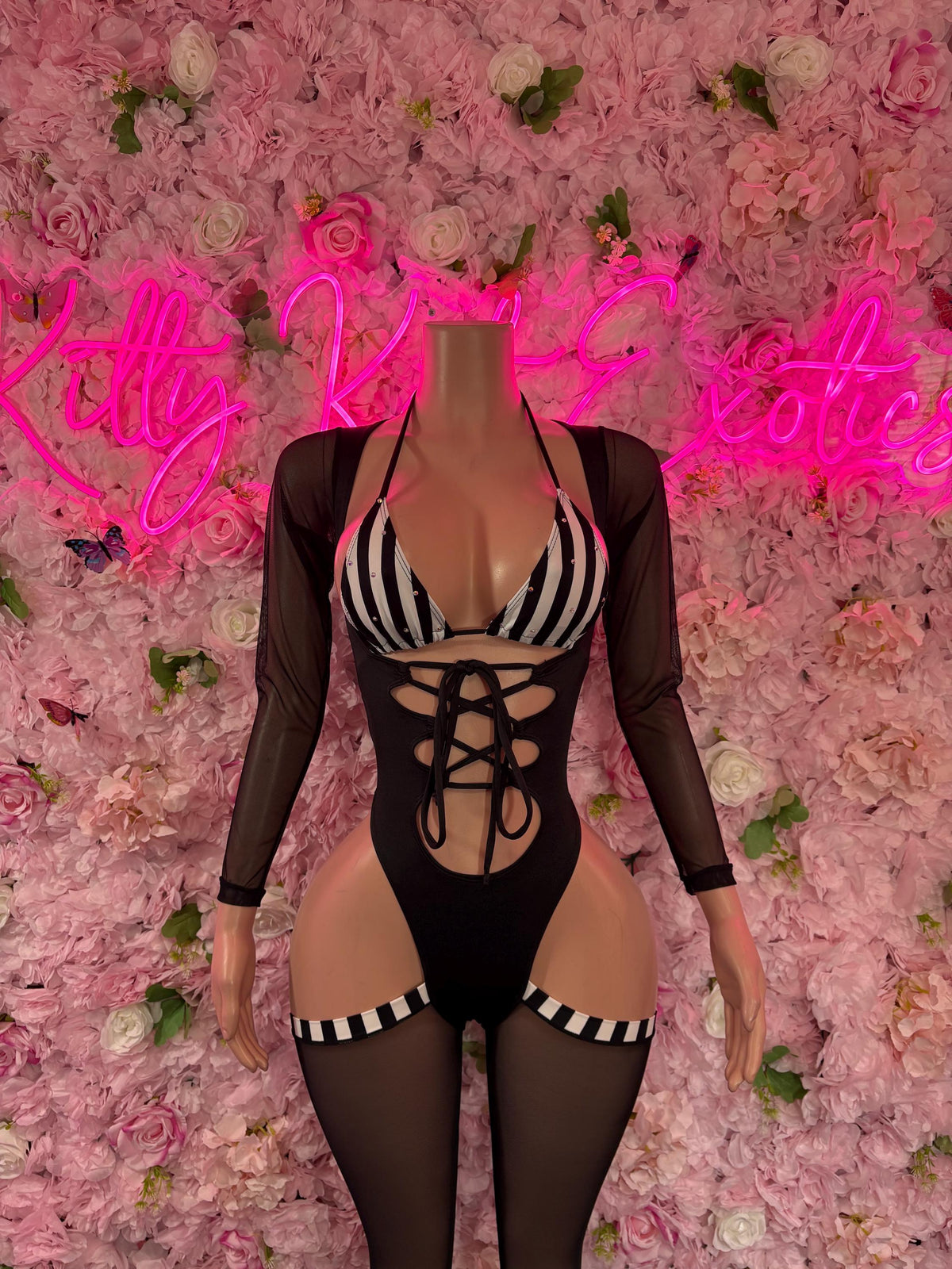 Black lace-up one-piece bodysuit with striped cups, long sleeves and thigh garters