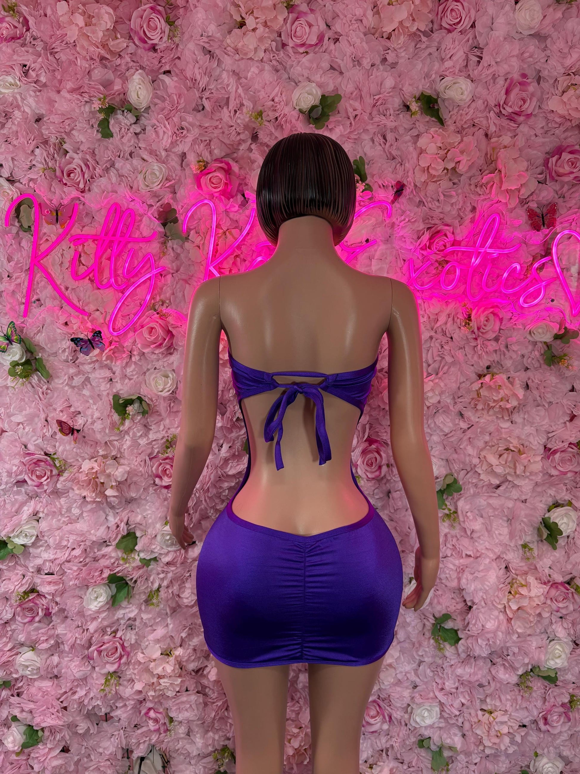 Purple back-tie romper dress with open back and ruched mini skirt