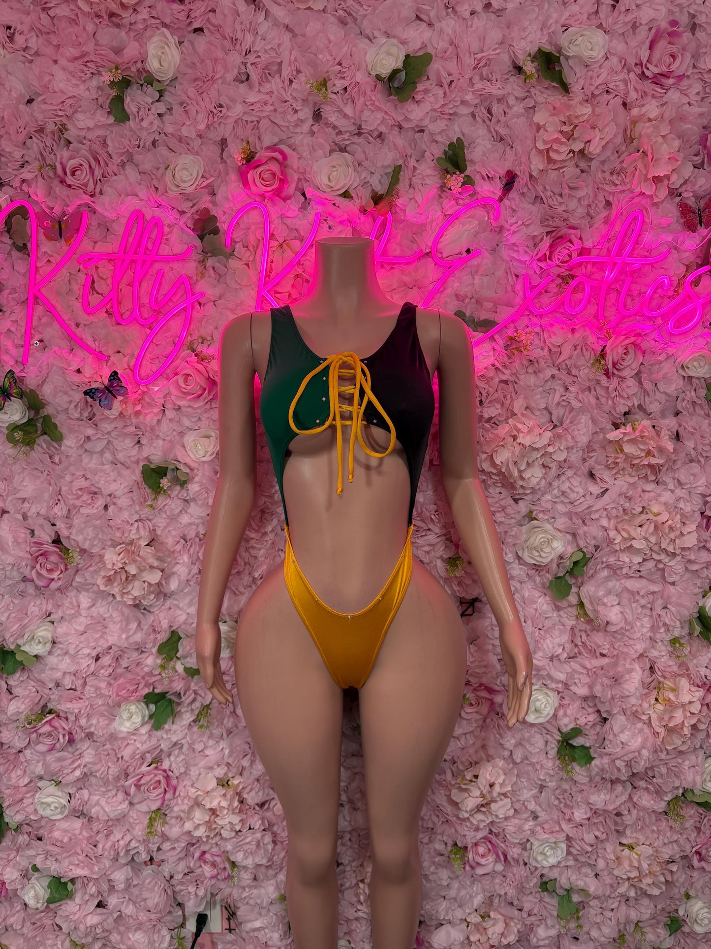 Jamaica flag one-piece swimsuit with lace-up front, green and gold panels on dark base