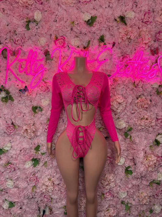 Pink lace one-piece bodysuit with long sleeves and crisscross back cutouts