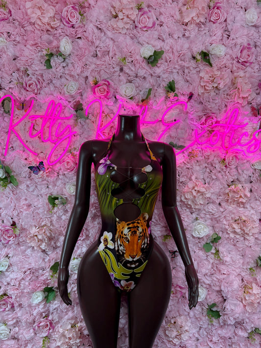 Black one-piece bodysuit with animal print and green orange graphic panel