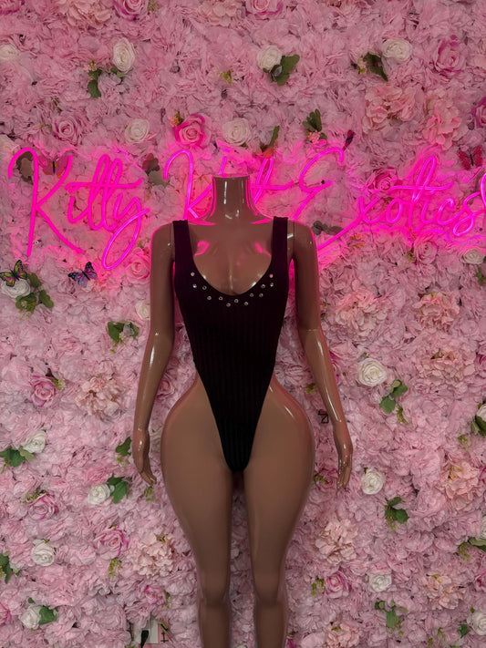 Black one-piece bodysuit with deep V neckline and rhinestone trim, sleeveless