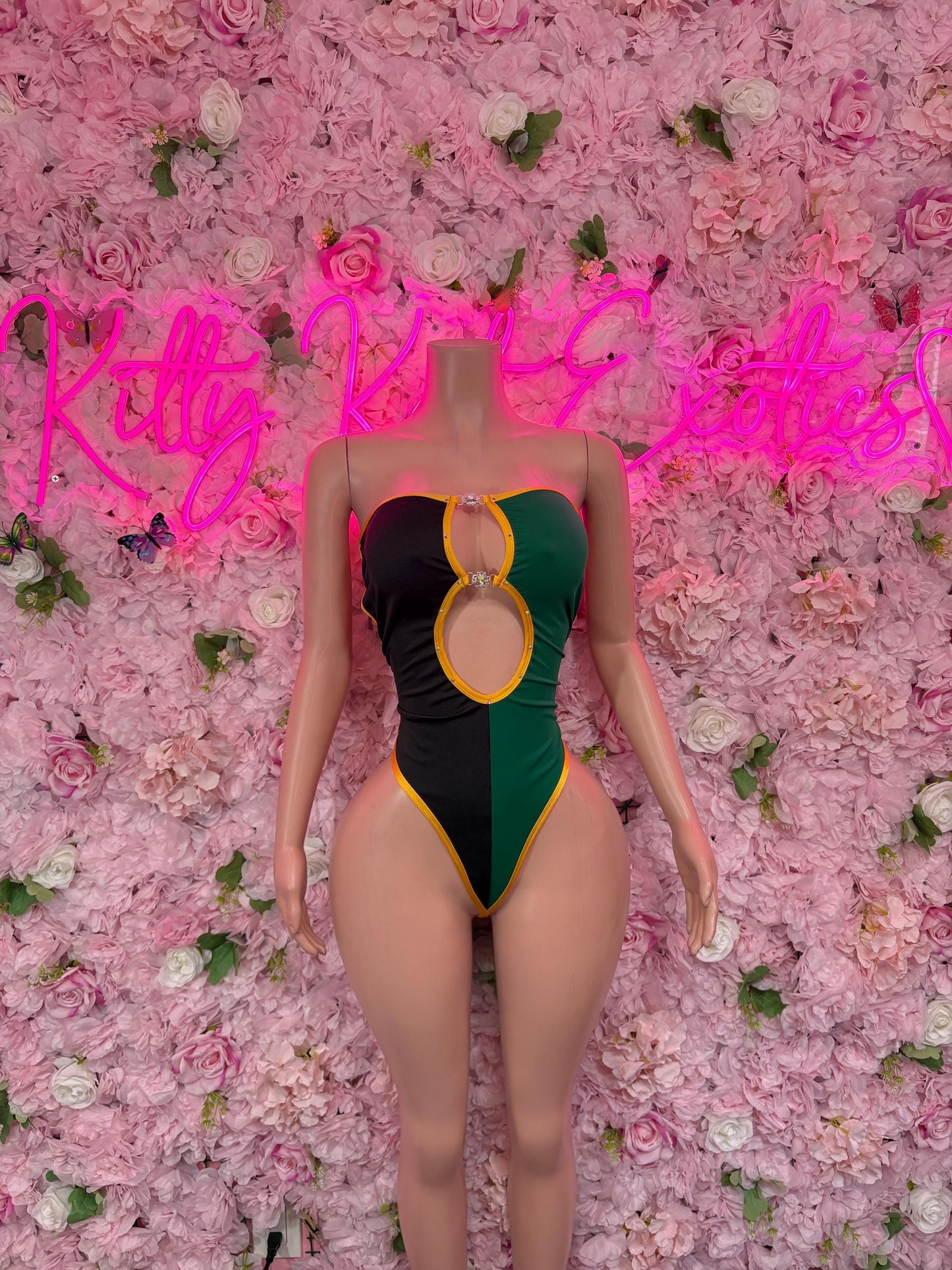 One-piece swimsuit in green/black/yellow with oval front cutout
