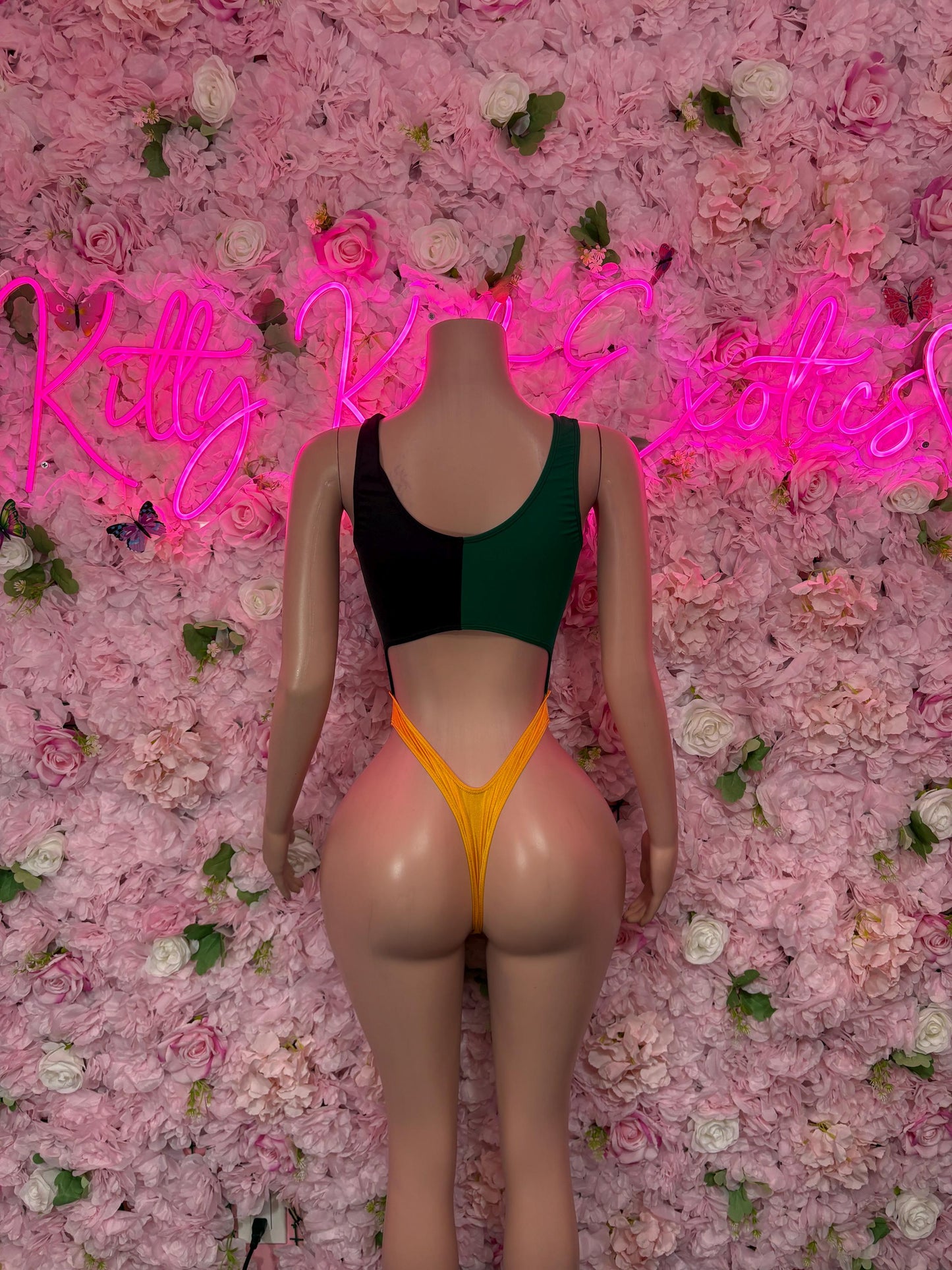 Jamaica flag one-piece swimsuit with scoop back, green and gold triangle panels on dark base