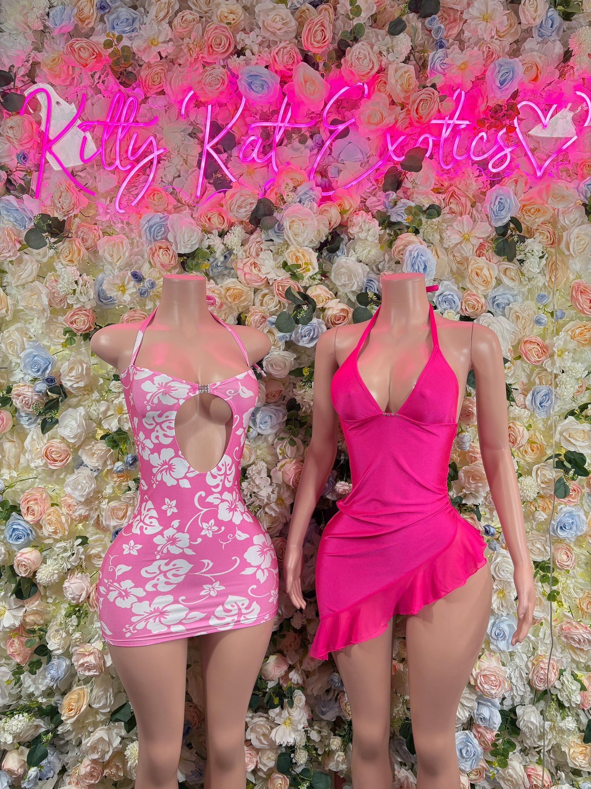 Two pink mini dance dresses: floral cutout on left, solid halter on right