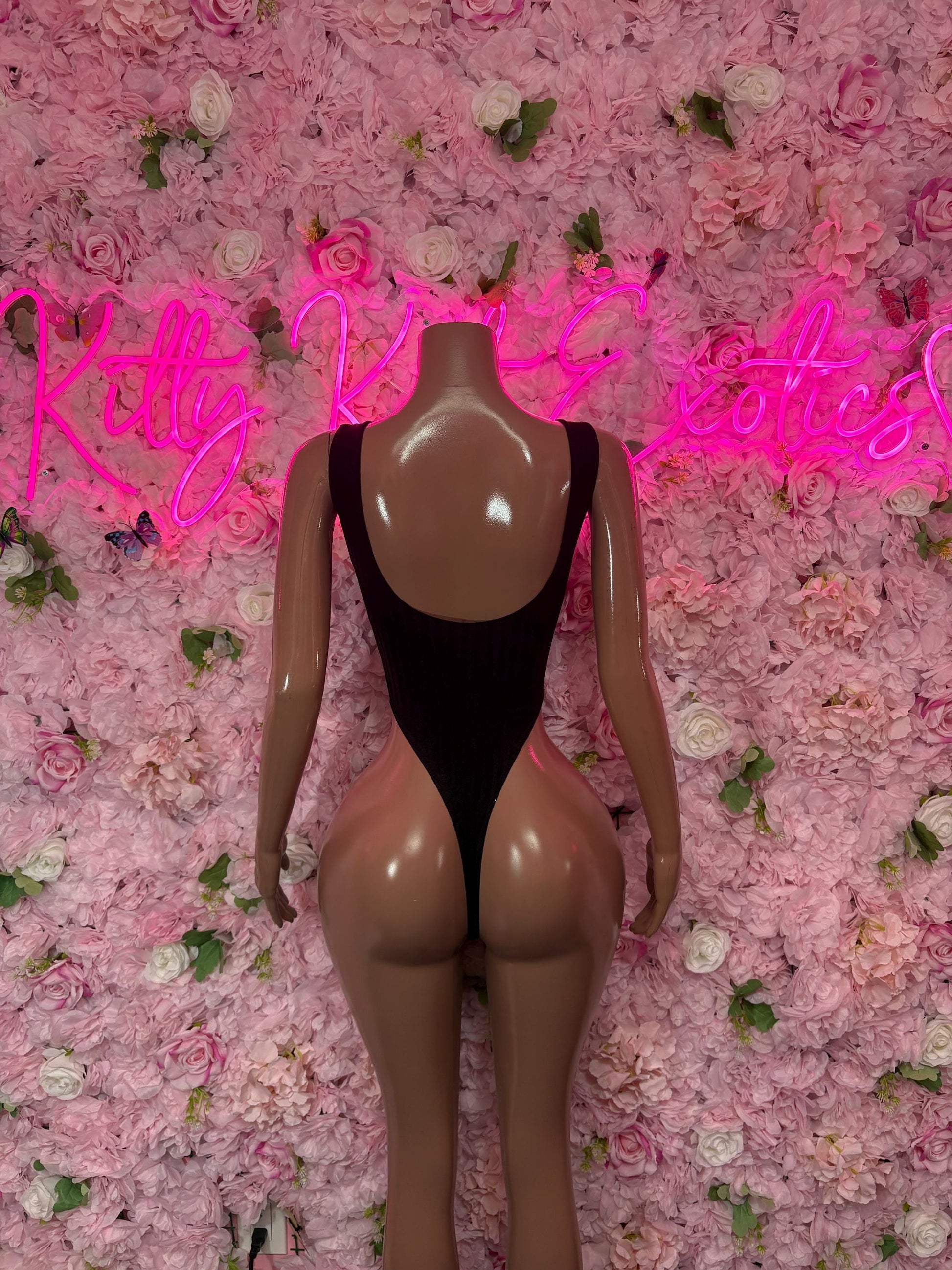Black backless one-piece bodysuit with high back and small gem details